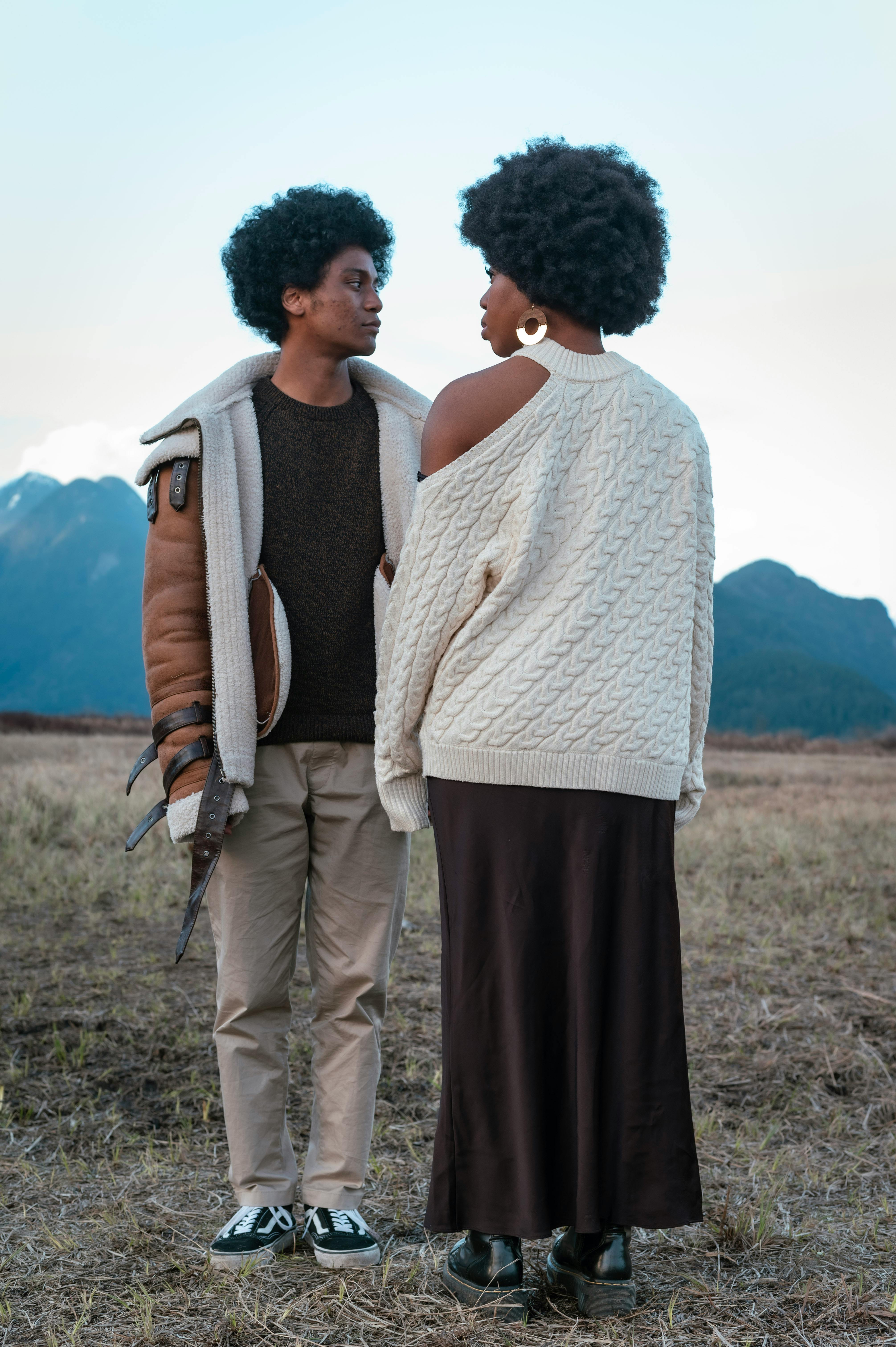 Two People Facing Each Other in Open Field