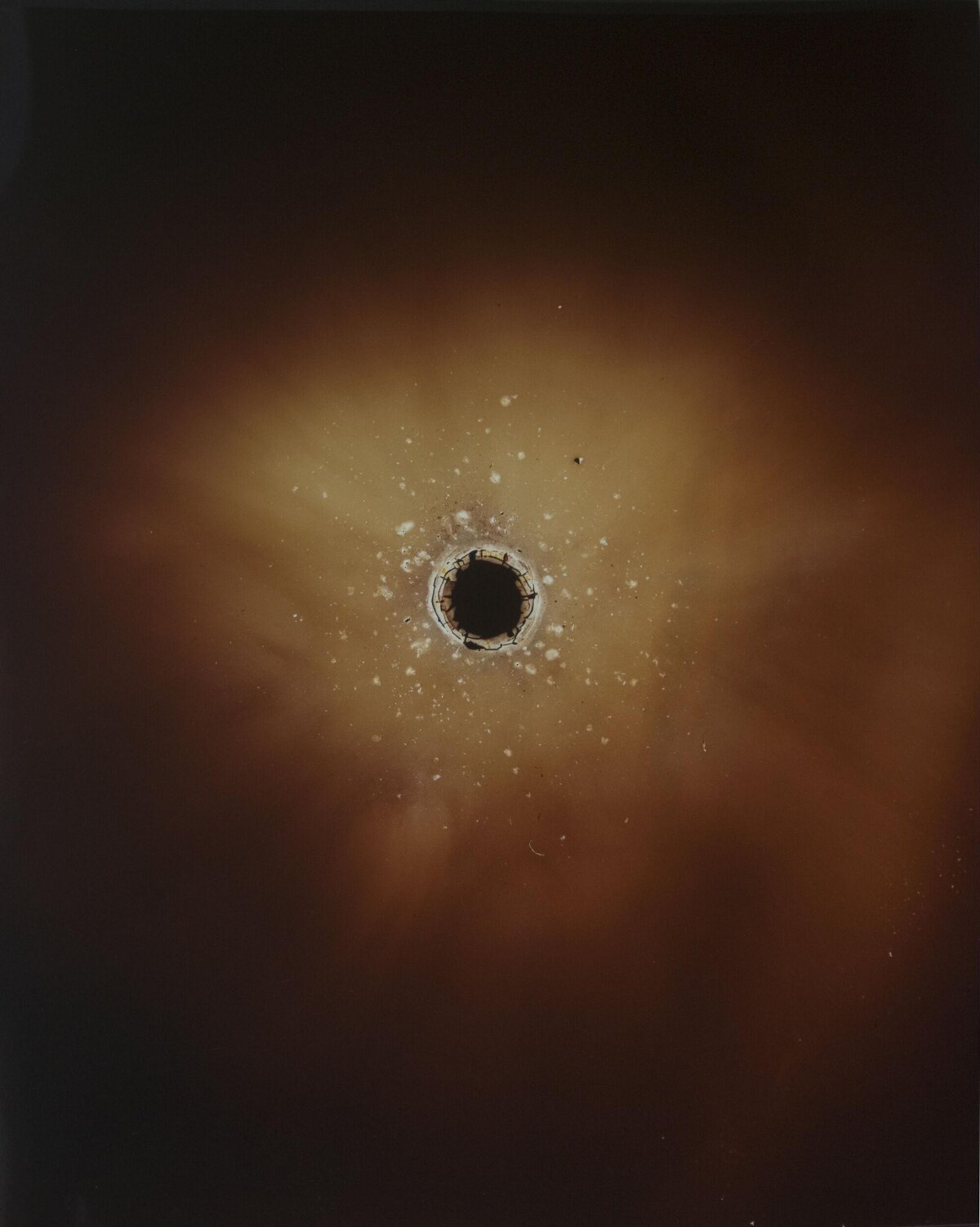 Dark Central Hole in Brown Haze