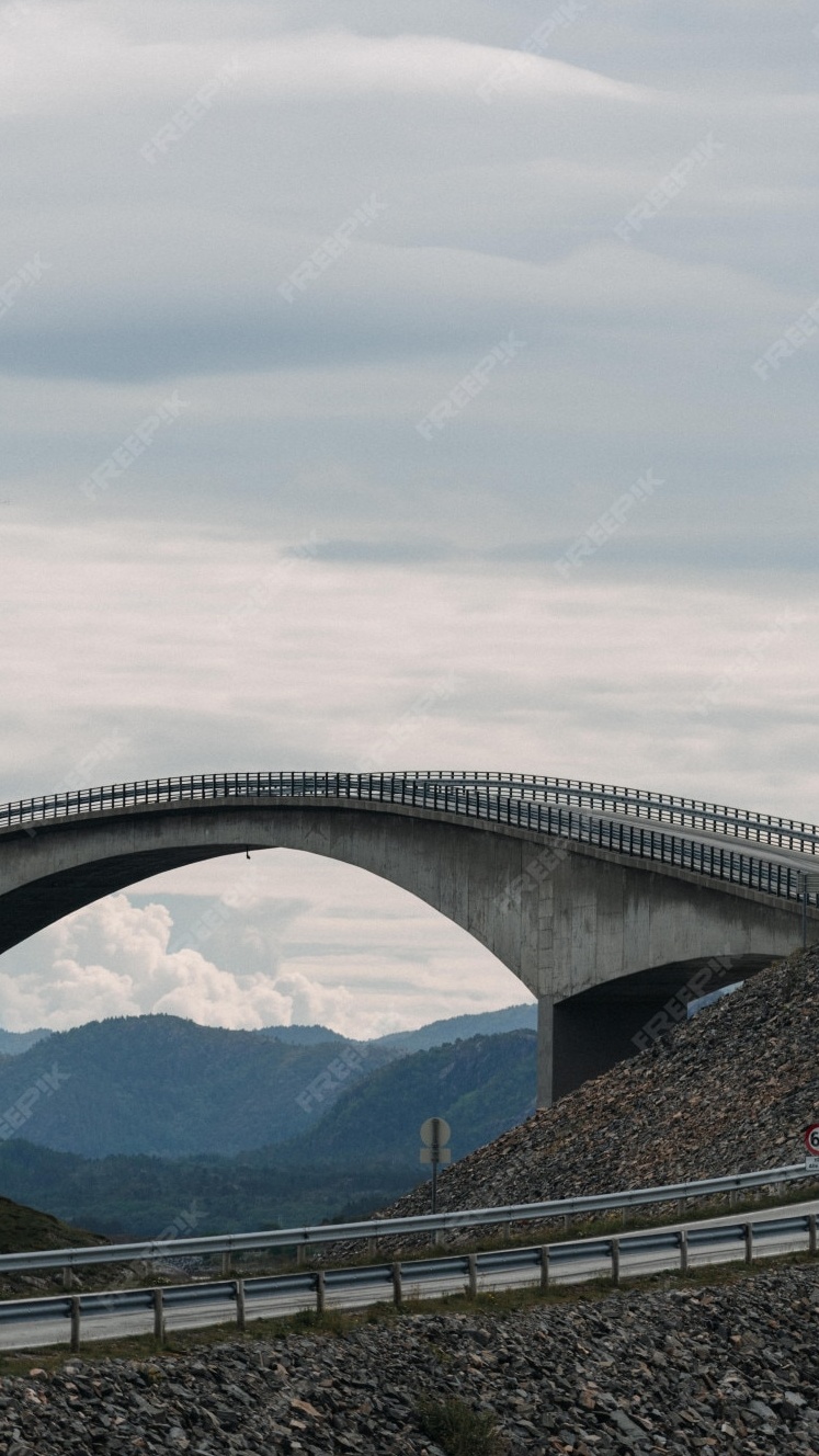 Concrete Arch Bridge Over Mountains