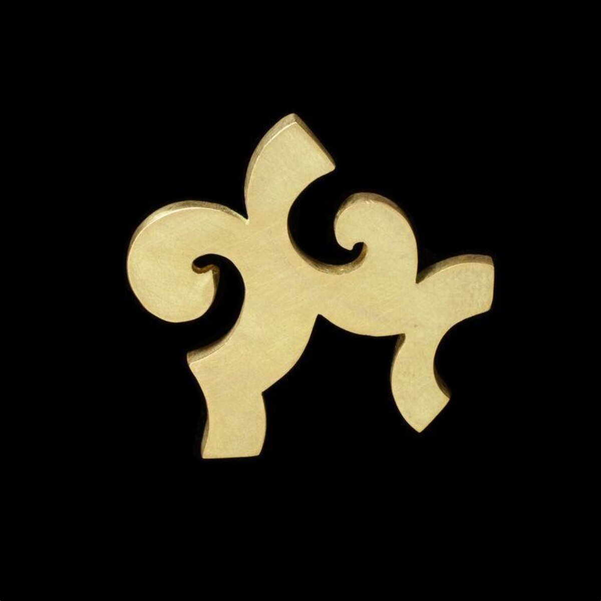 Brass Scroll Shaped Puzzle Piece — Logos