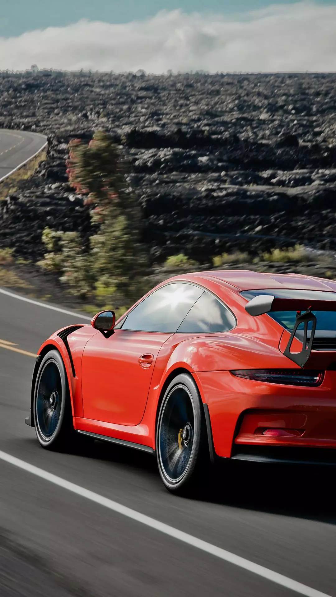 Red Sports Car On Winding Road