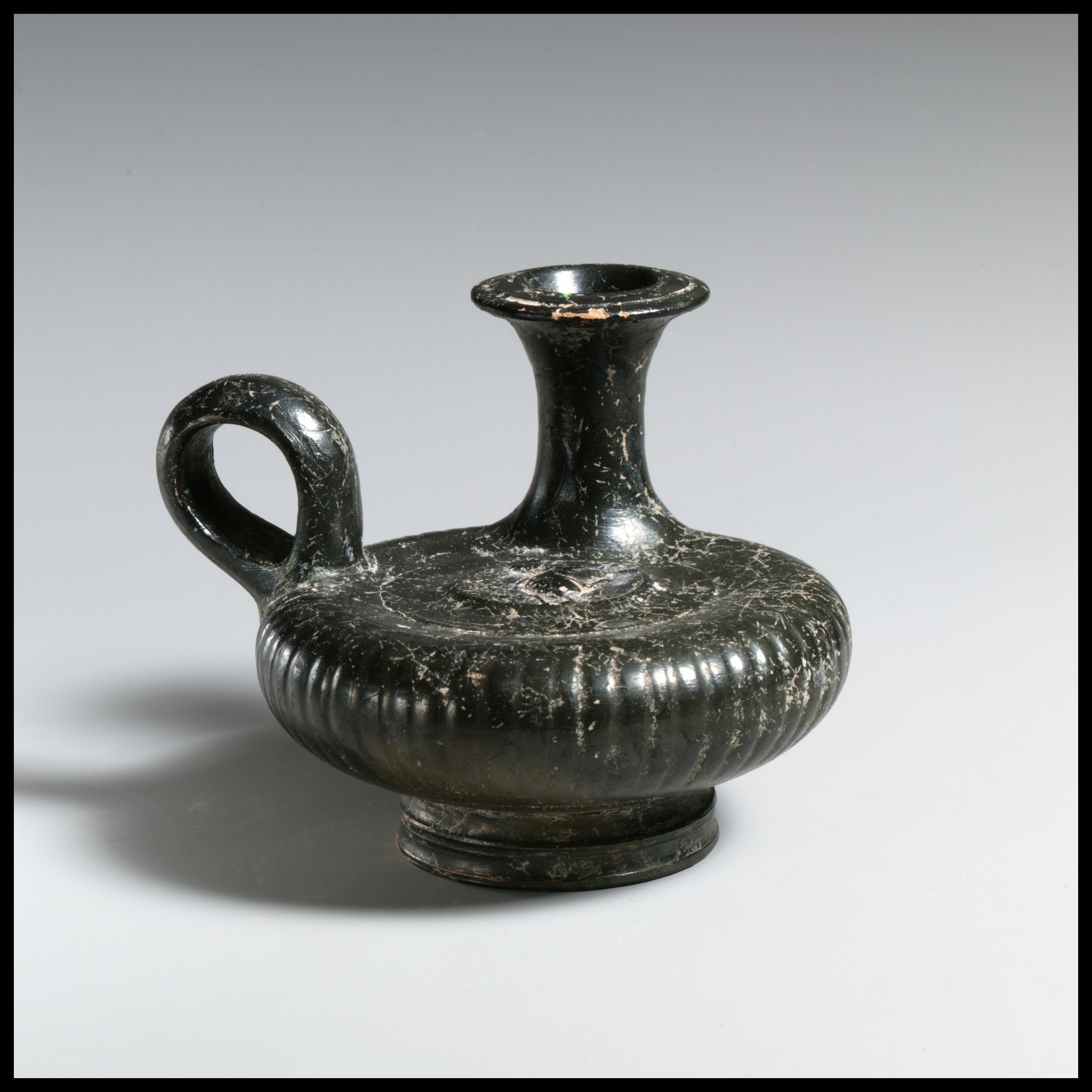Ancient Black Glazed Handled Vessel