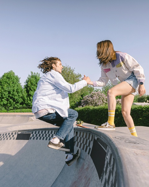 Two Skaters At Outdoor Skatepark