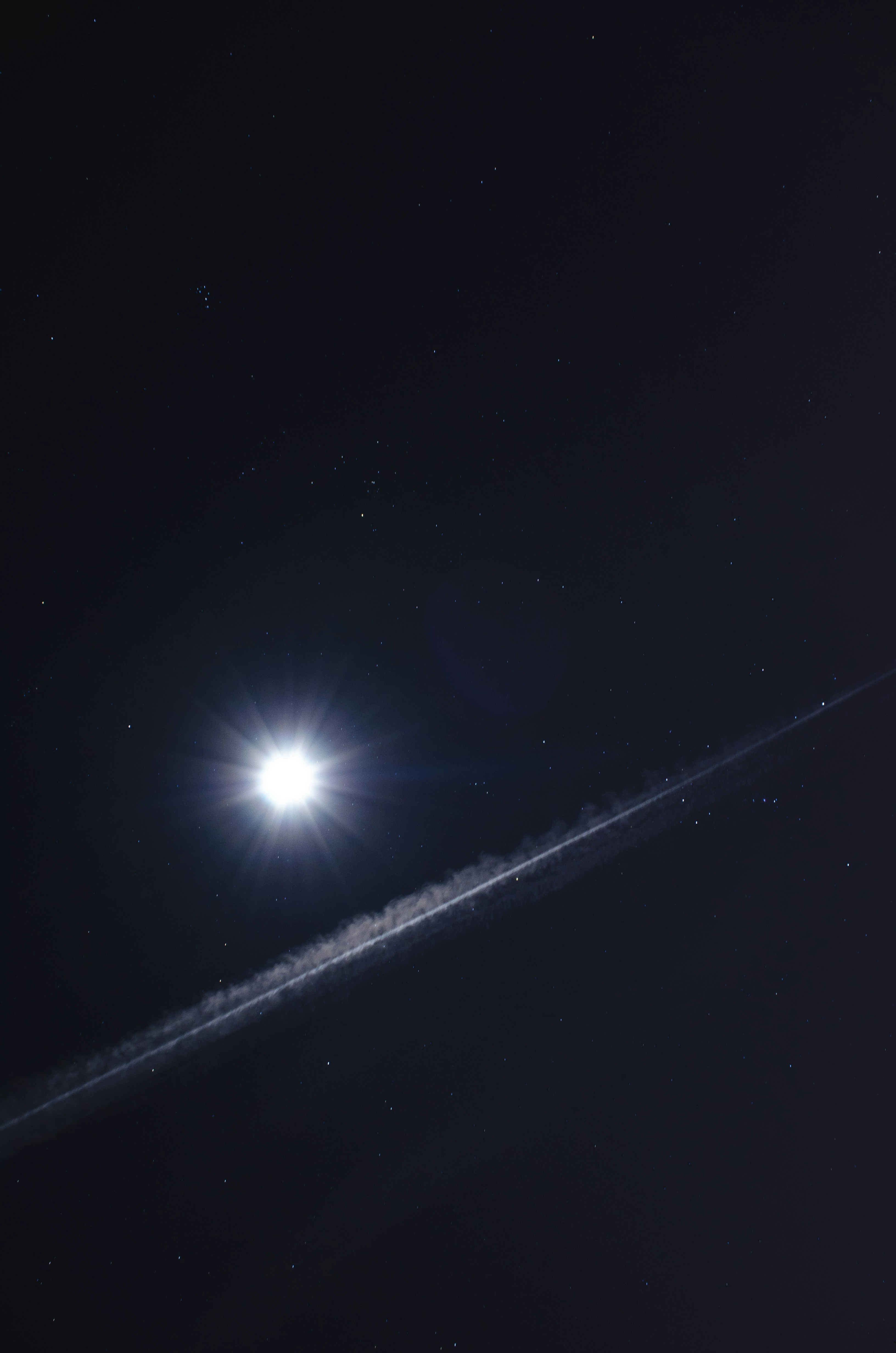 Night Sky with Bright Star and Contrail