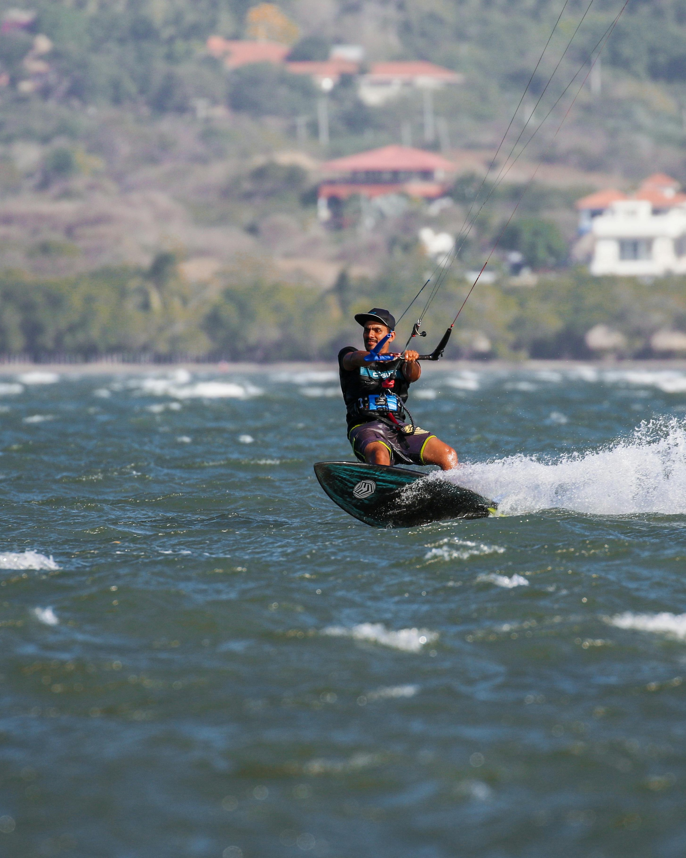Man Kitesurfing on Coastal Waters