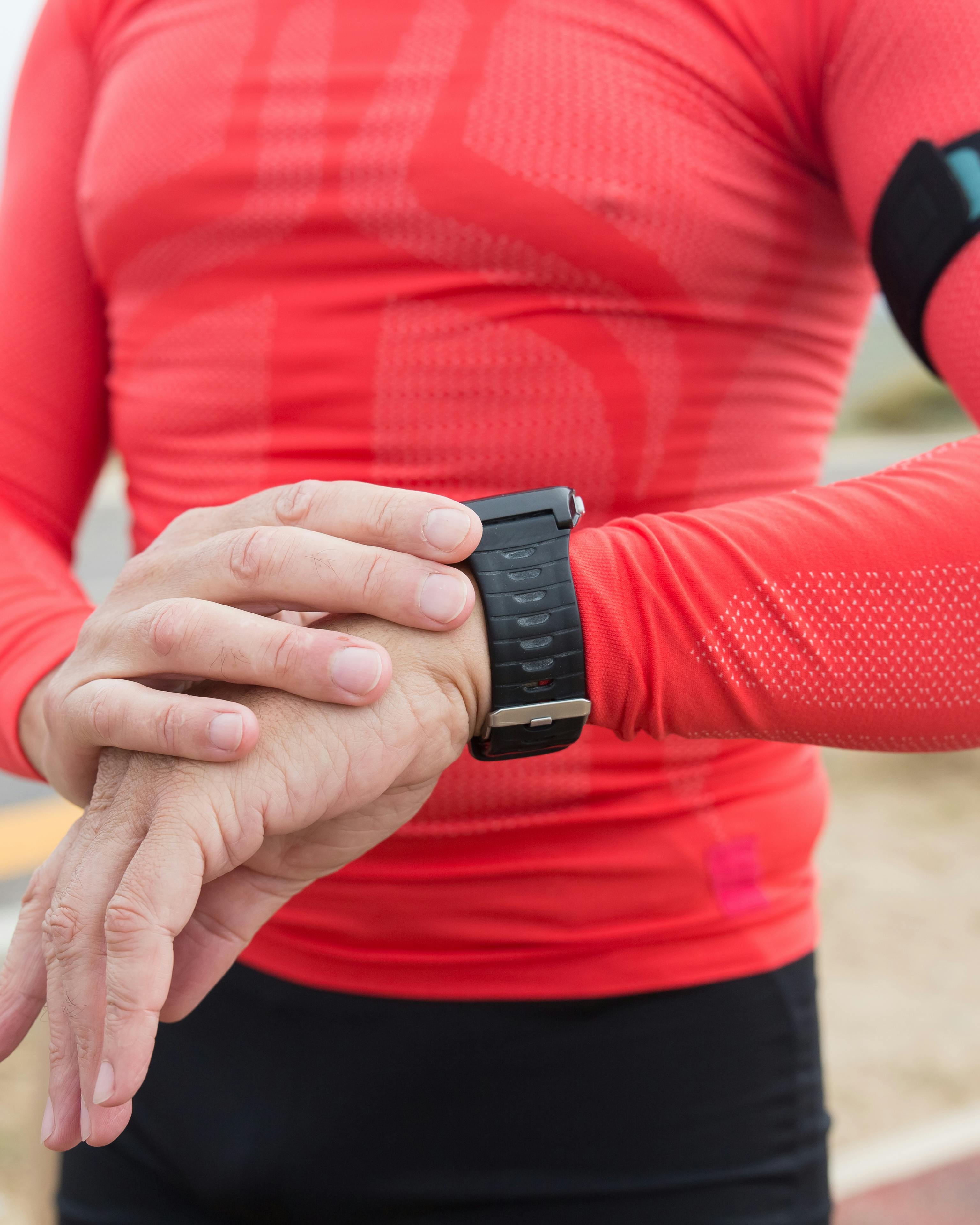 Runner Checking Fitness Smartwatch