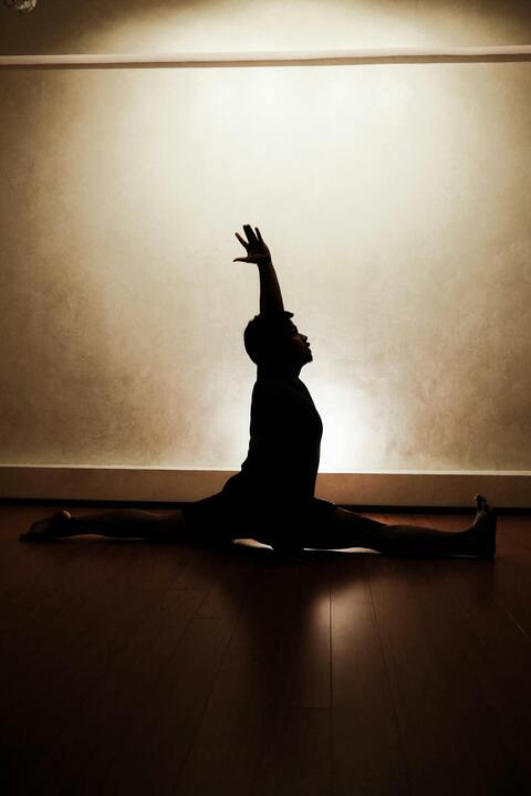 Silhouette of Person Doing Yoga Split