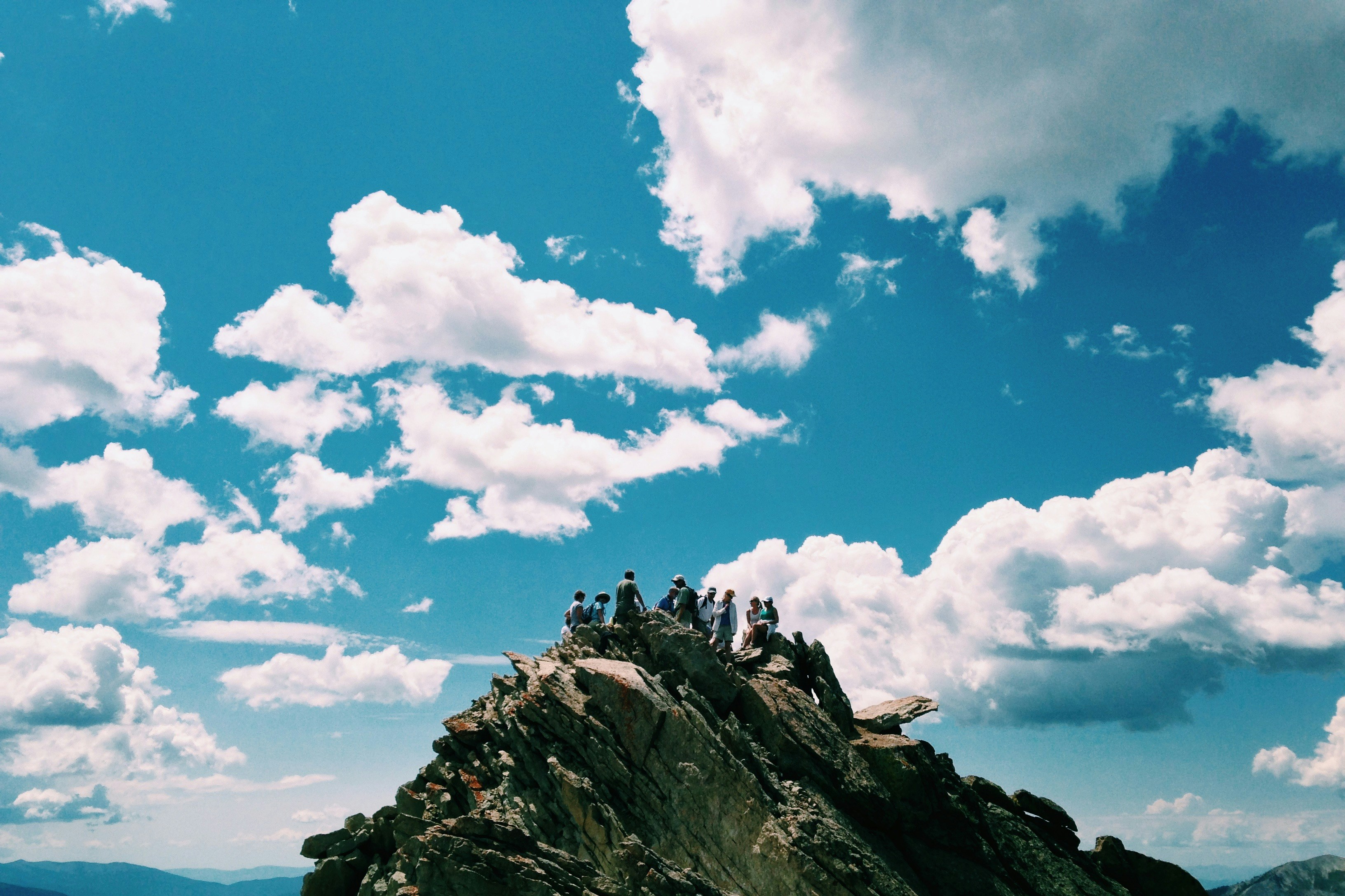 Hikers on Mountain Peak Summit