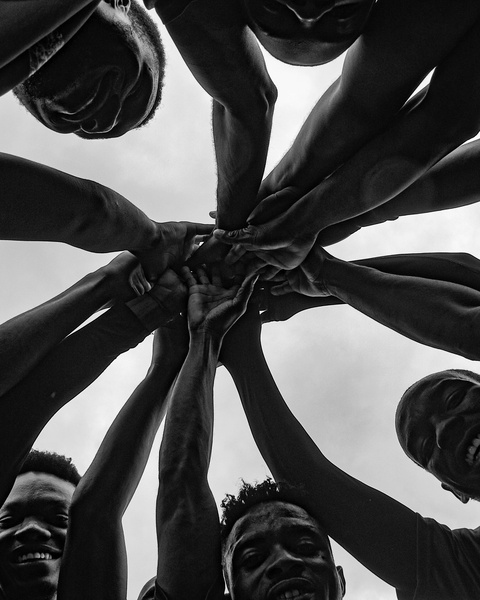 Team Huddle With Stacked Hands