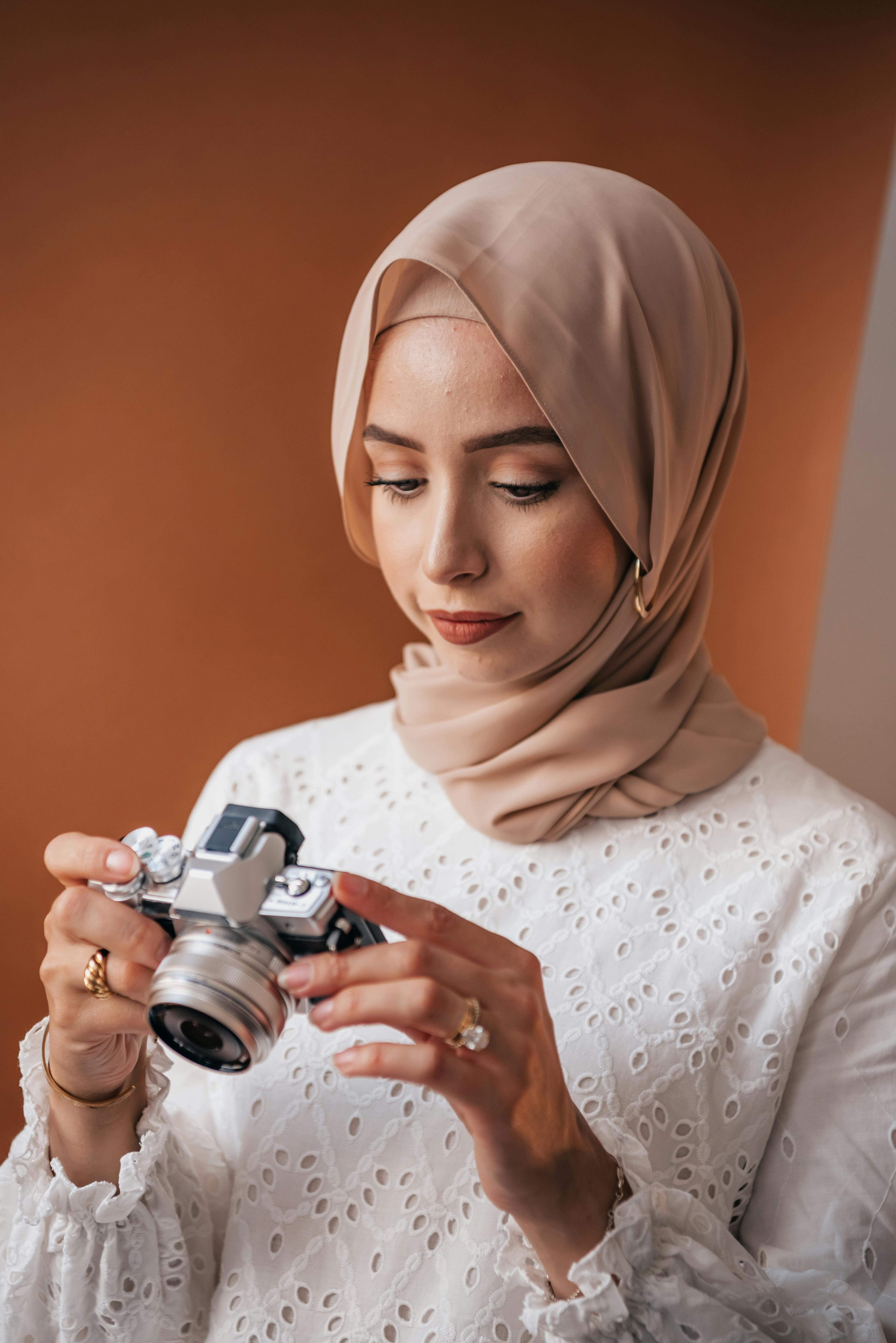 Hijabi Photographer Checking Camera