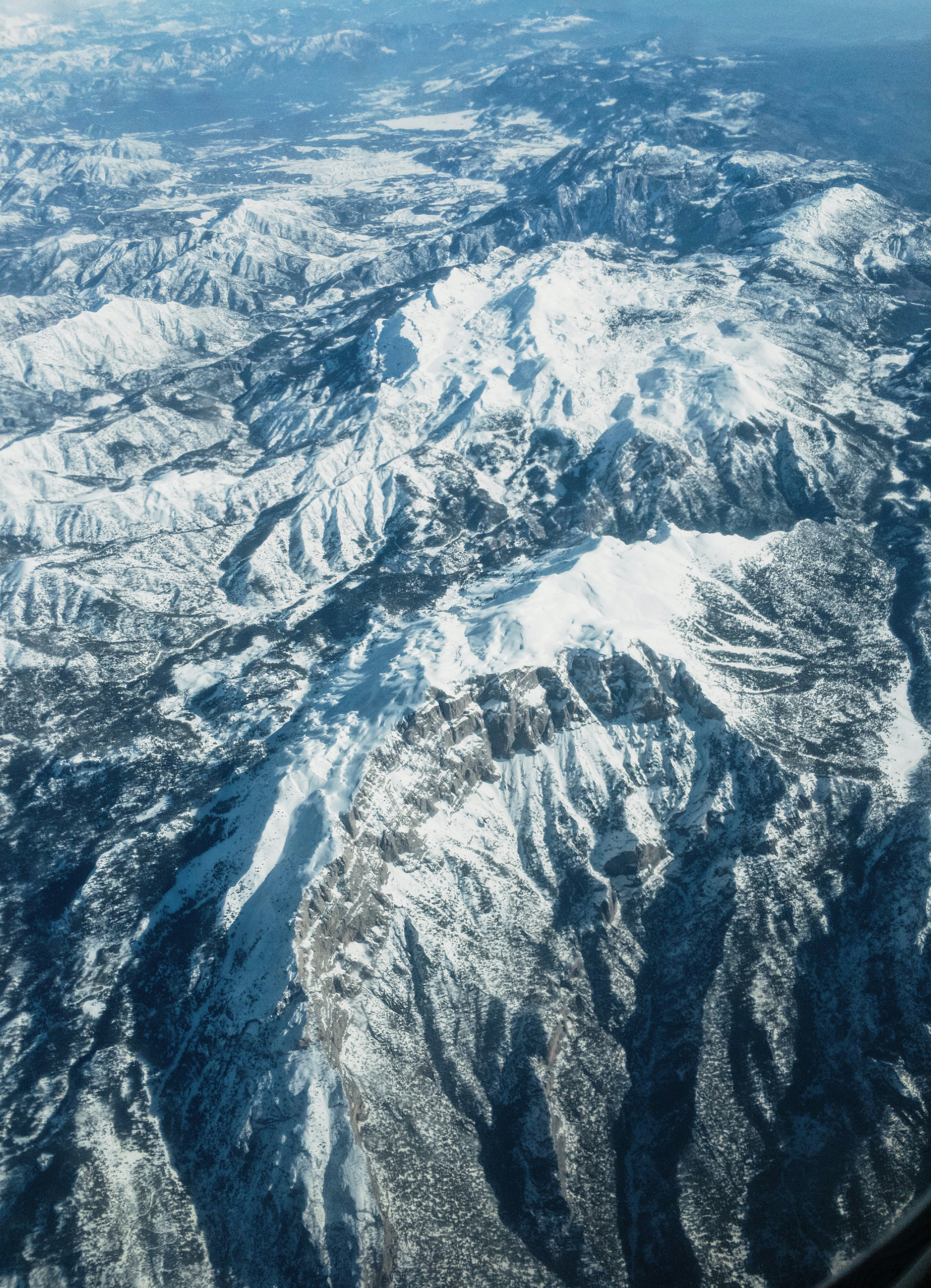 Aerial View of Snow-capped Mountains