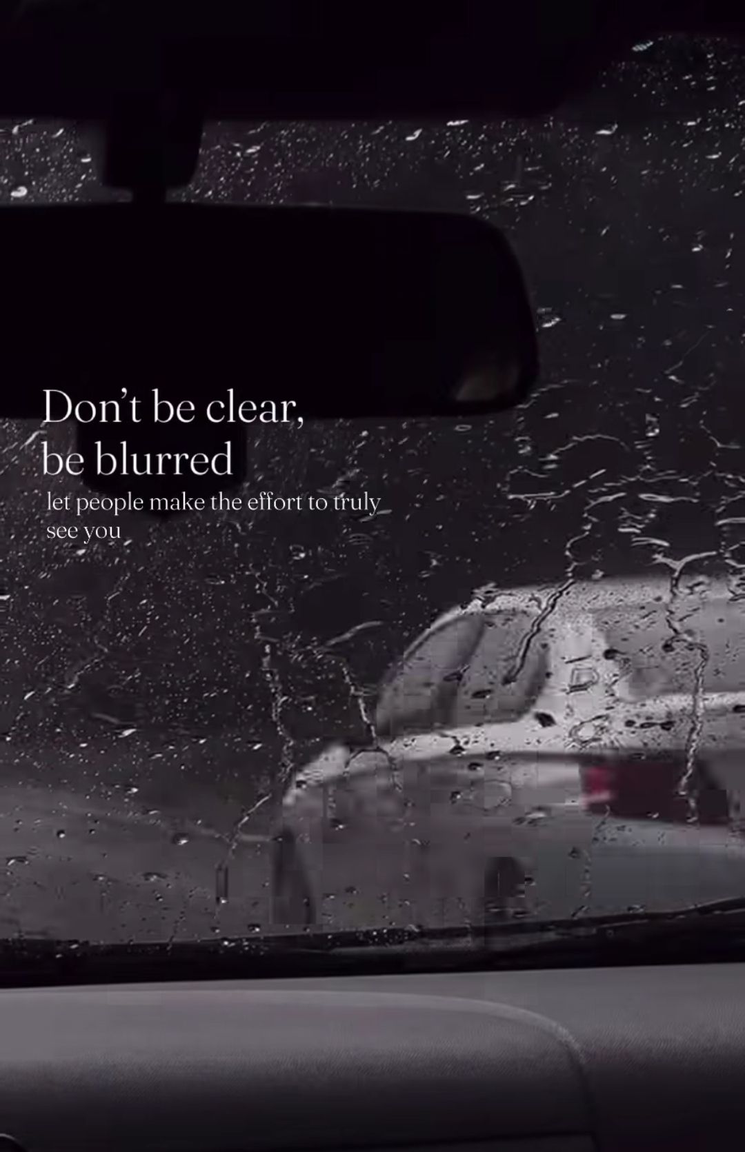 Rainy Car Windshield with Quote