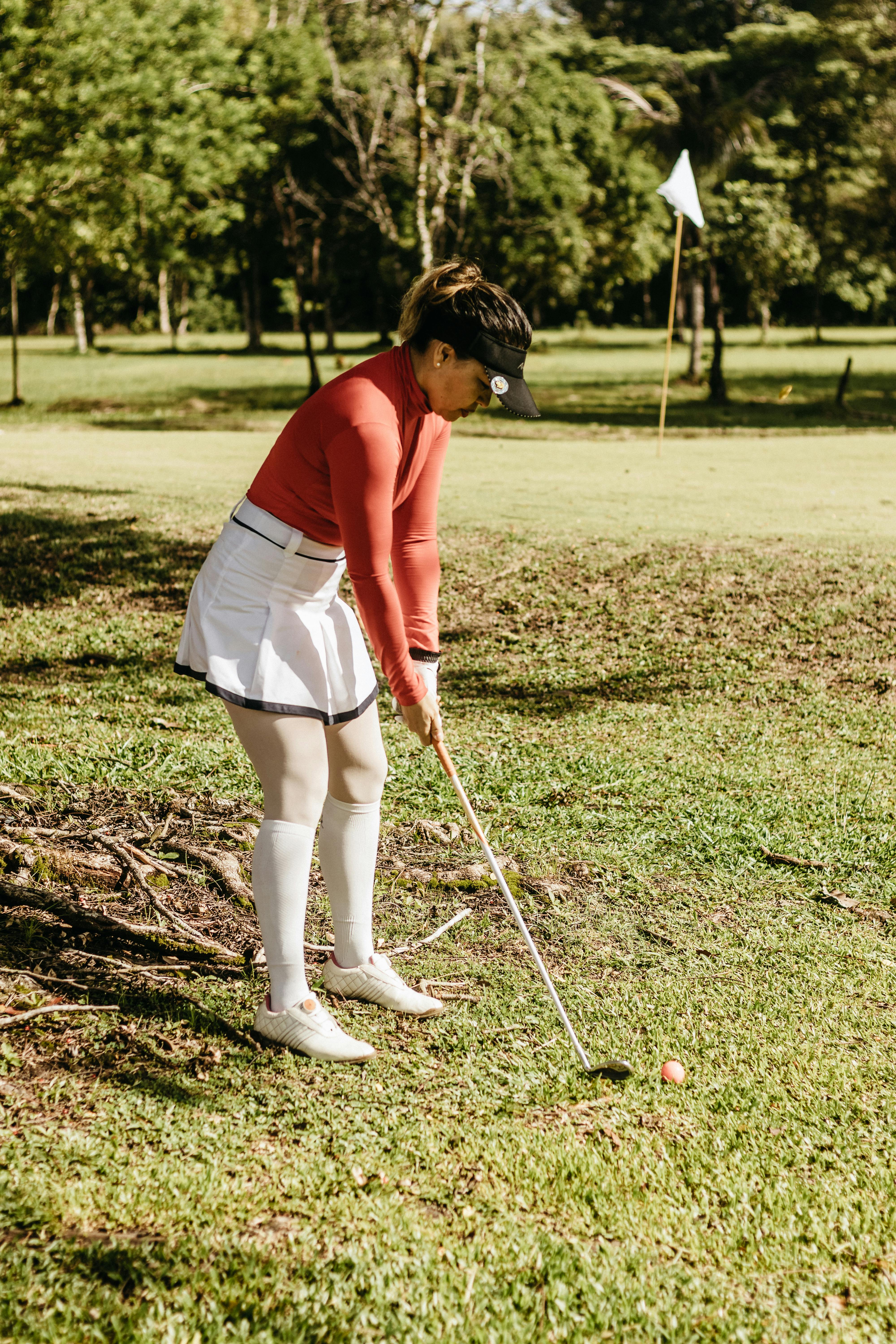 Woman Preparing to Hit Golf Shot