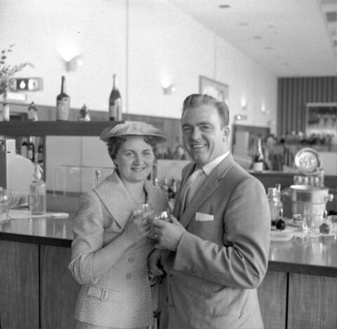 Couple Toasting at a Bar