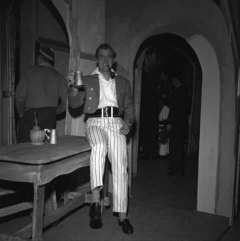 Man Holding Tankard Posing in Tavern