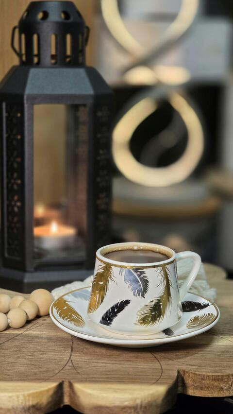 Feather Pattern Coffee Cup on Wood Slab