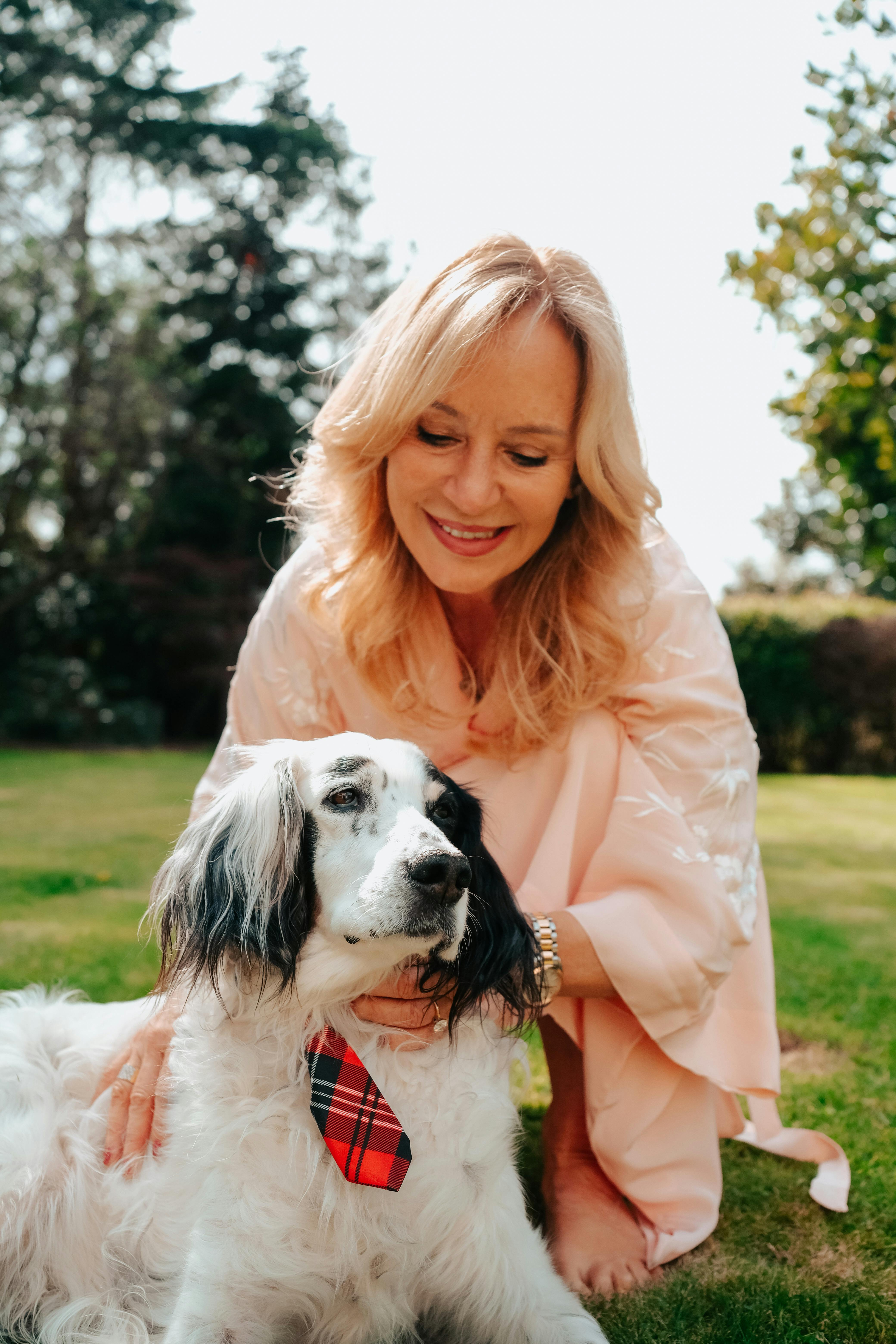 Blonde Woman With Dog In Garden