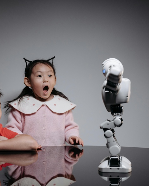 Surprised Girl Looking at Robot