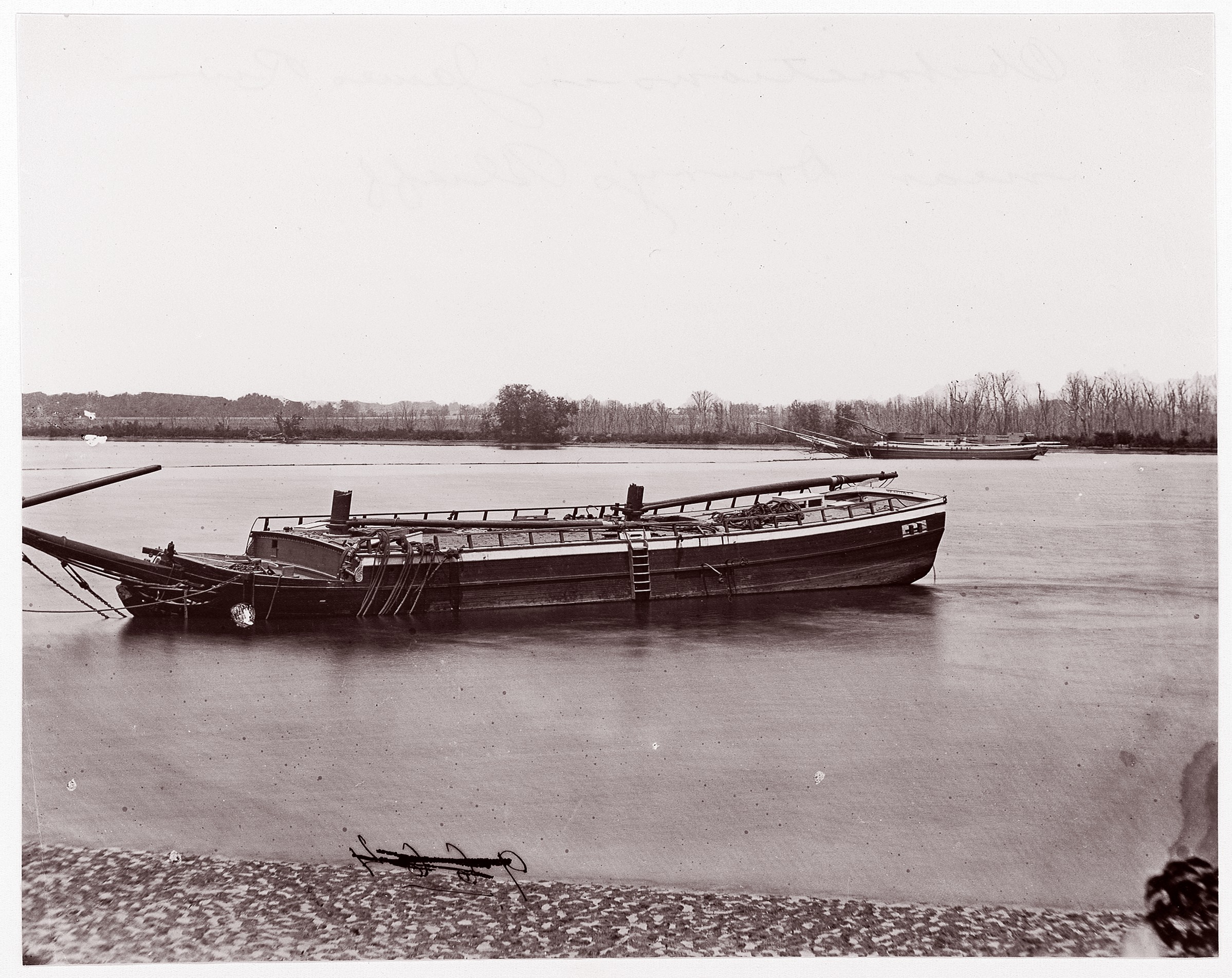 Partially Submerged Barge on River