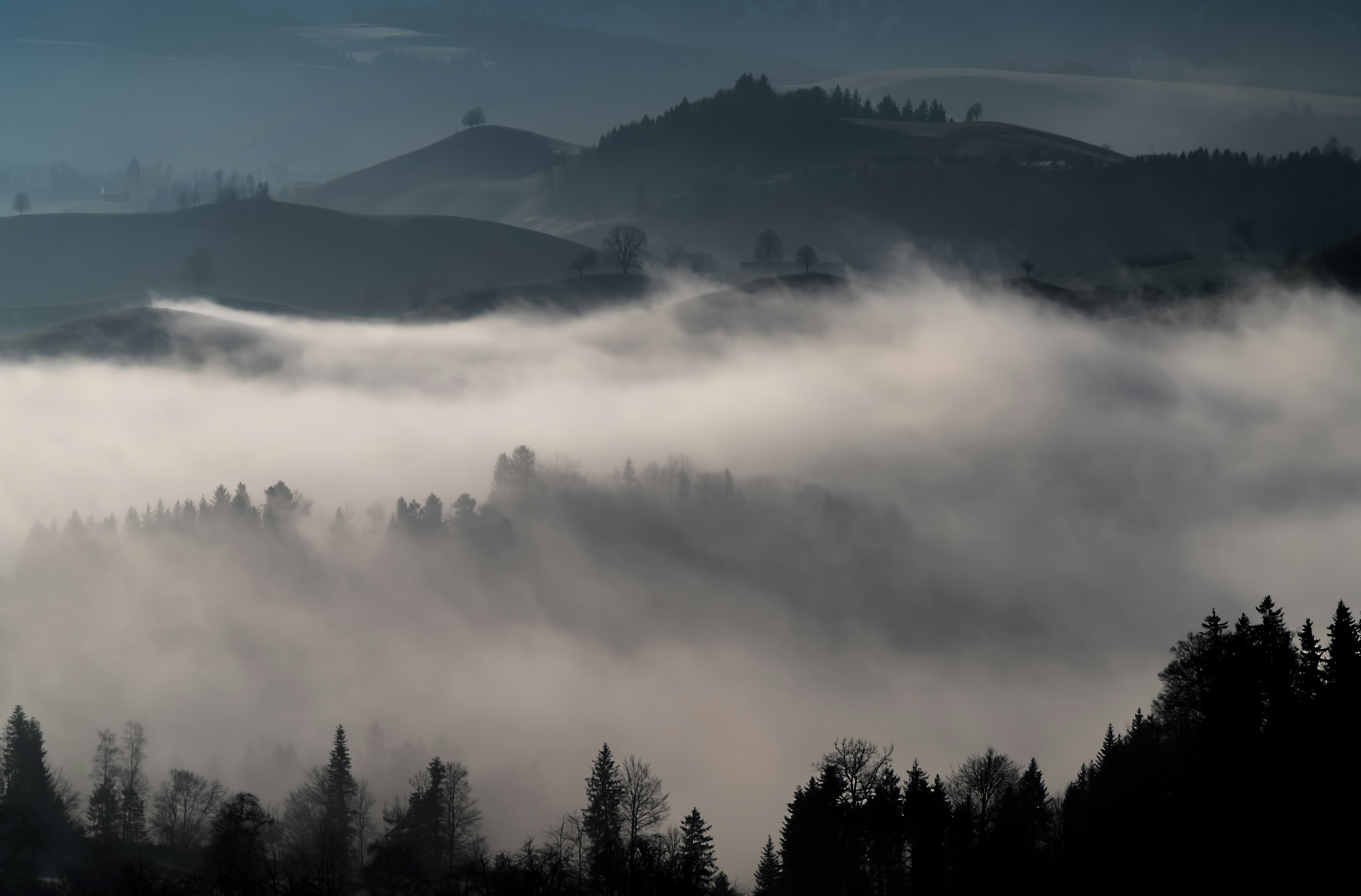 Misty Layered Hilly Landscape