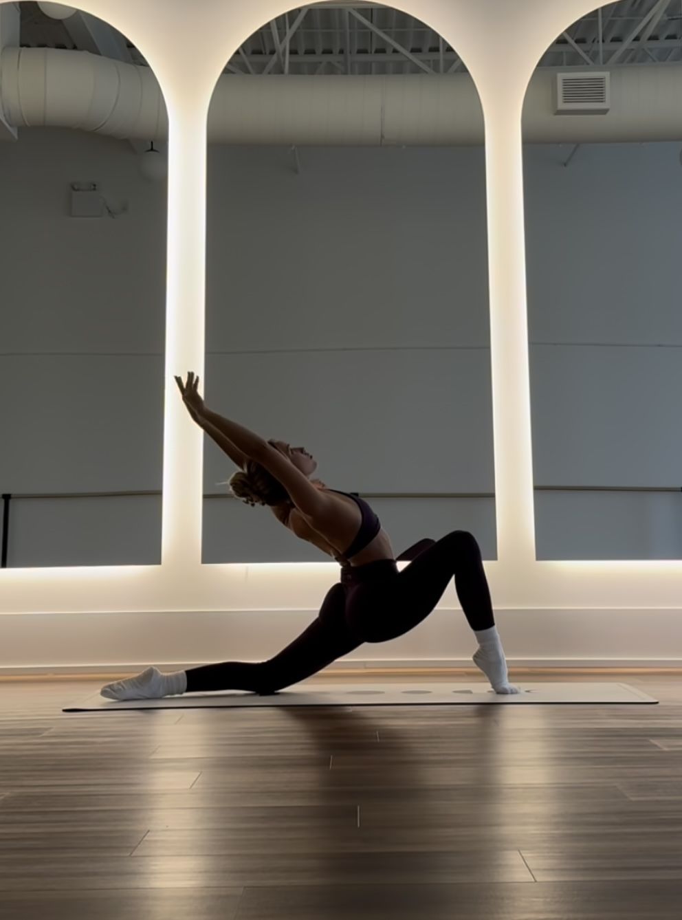 Woman Practicing Yoga in Studio