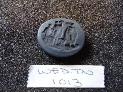 Ancient Carved Coin With Handwritten Tag