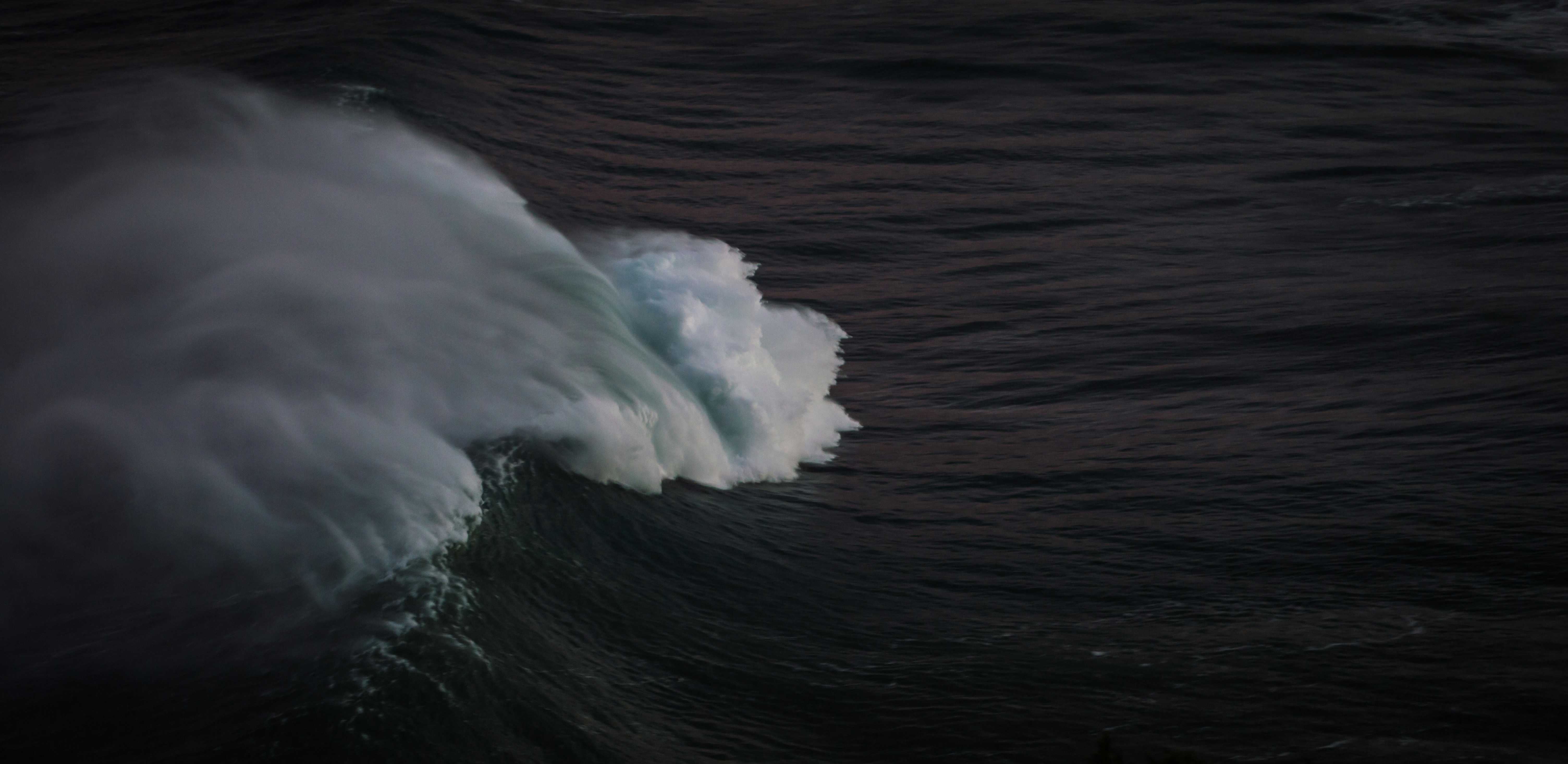 Breaking Ocean Wave at Dusk