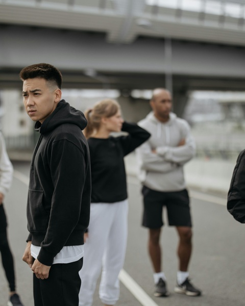 Runners Gathering Under Urban Overpass