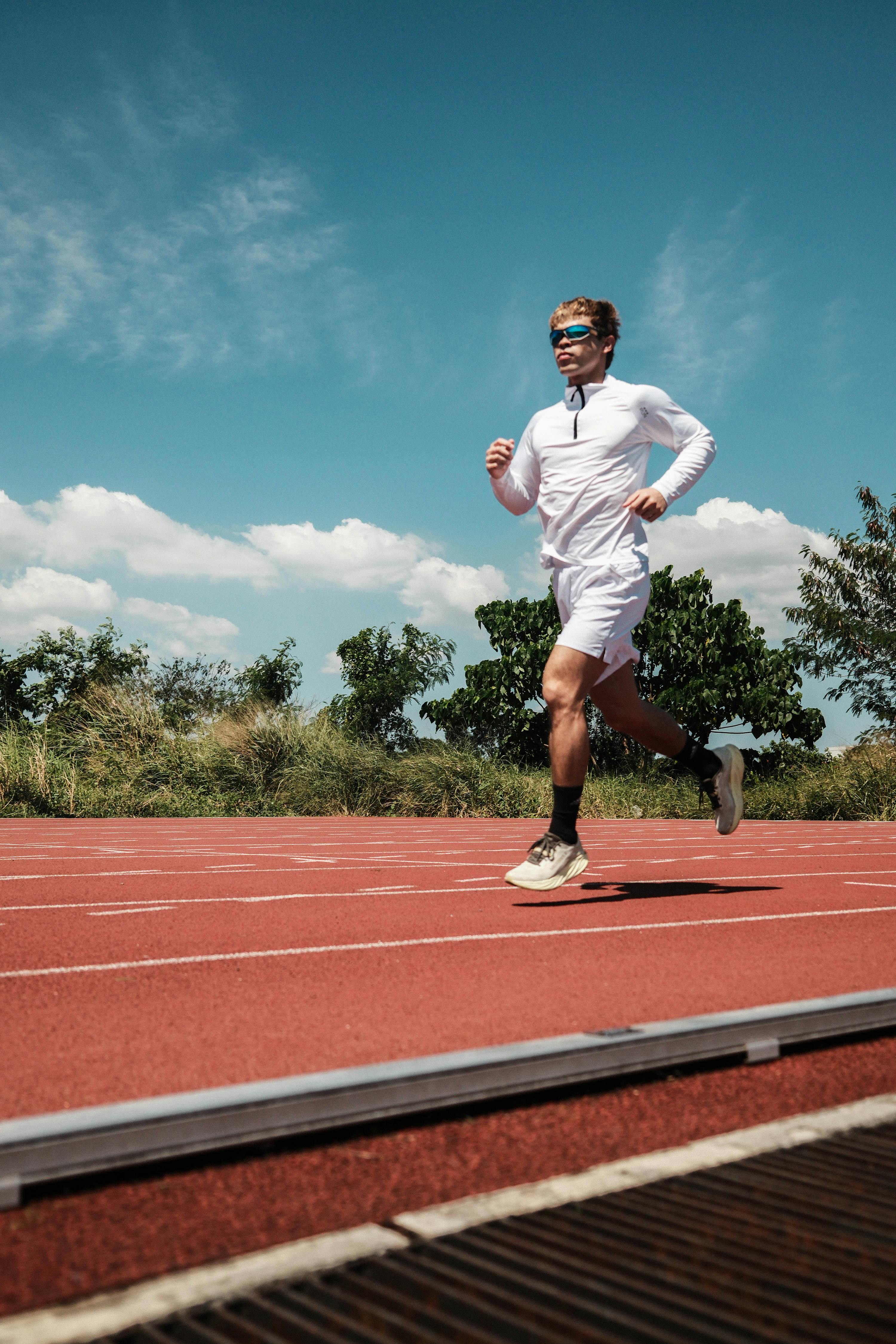 Runner Jogging on Outdoor Running Track