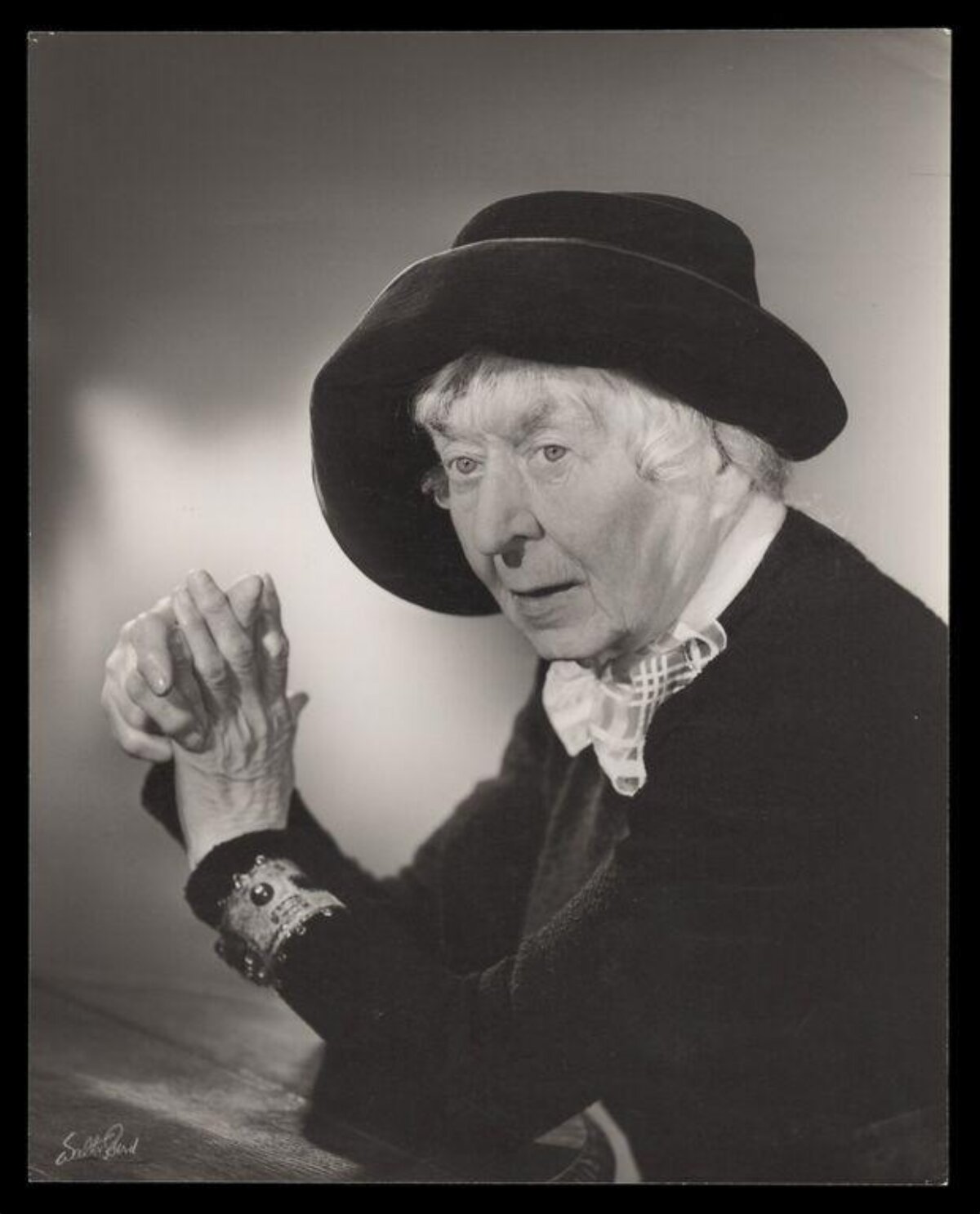 Studio Portrait of Elderly Person in Hat