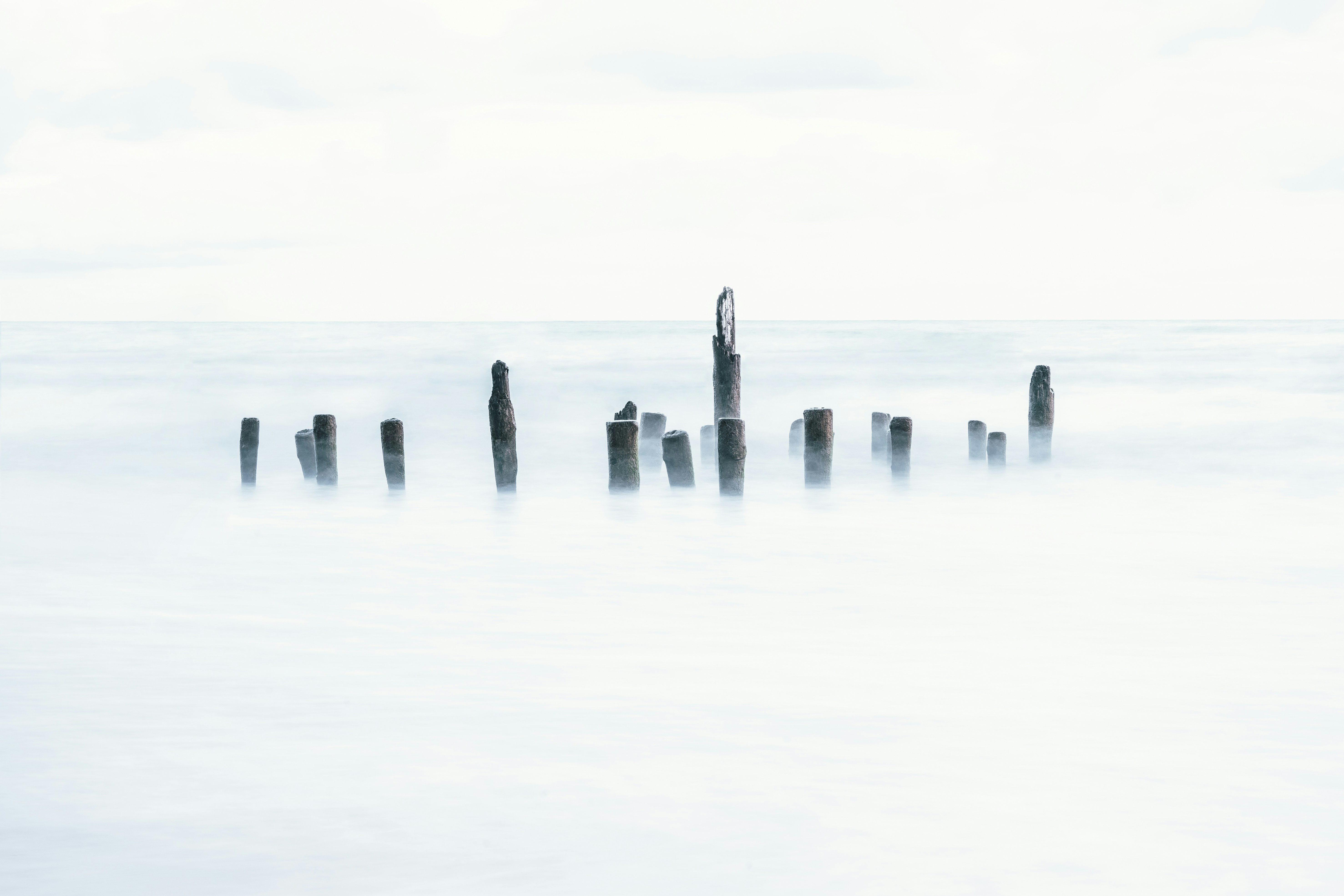 Old Pilings in Calm Misty Sea