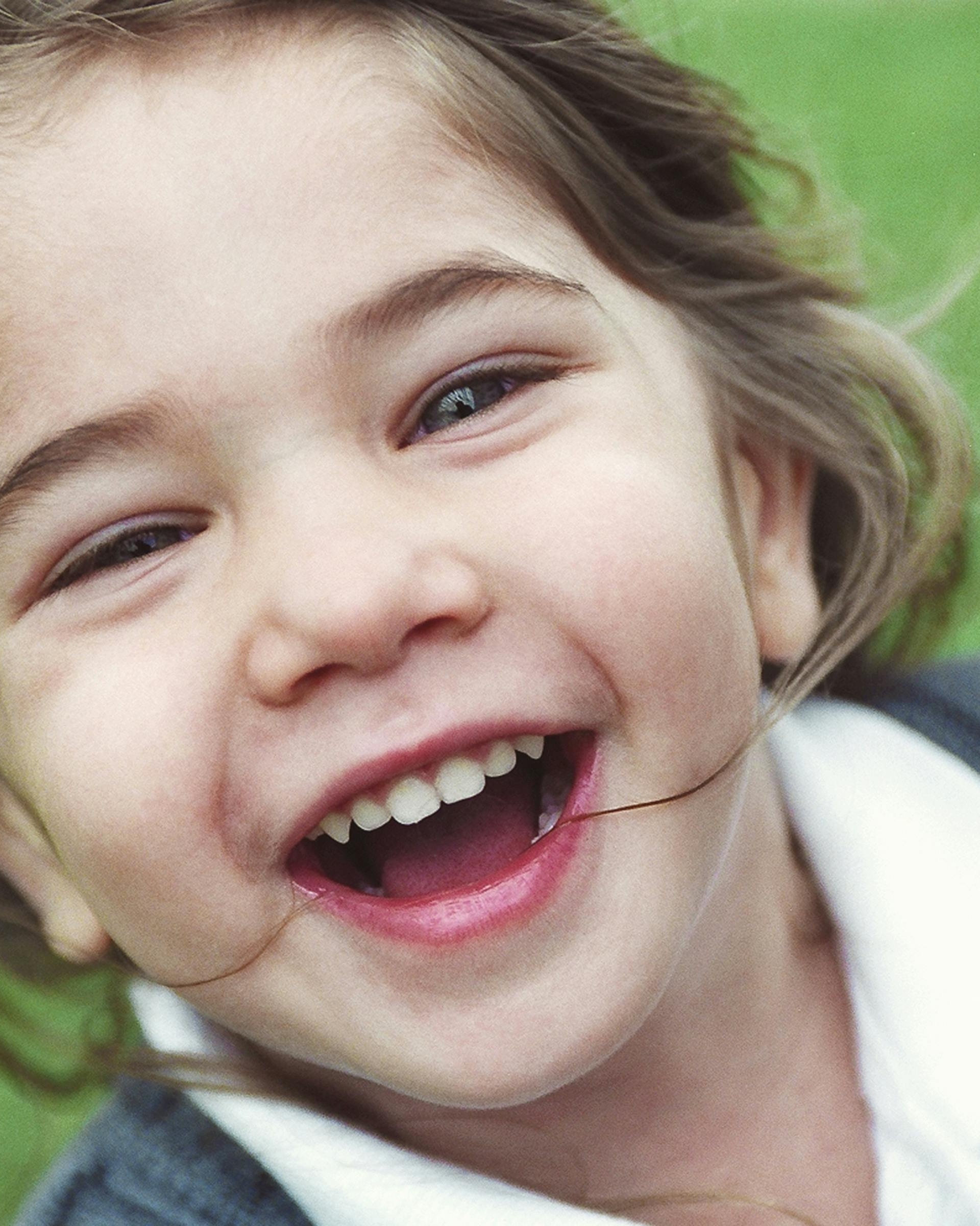 Close-up of Laughing Little Girl