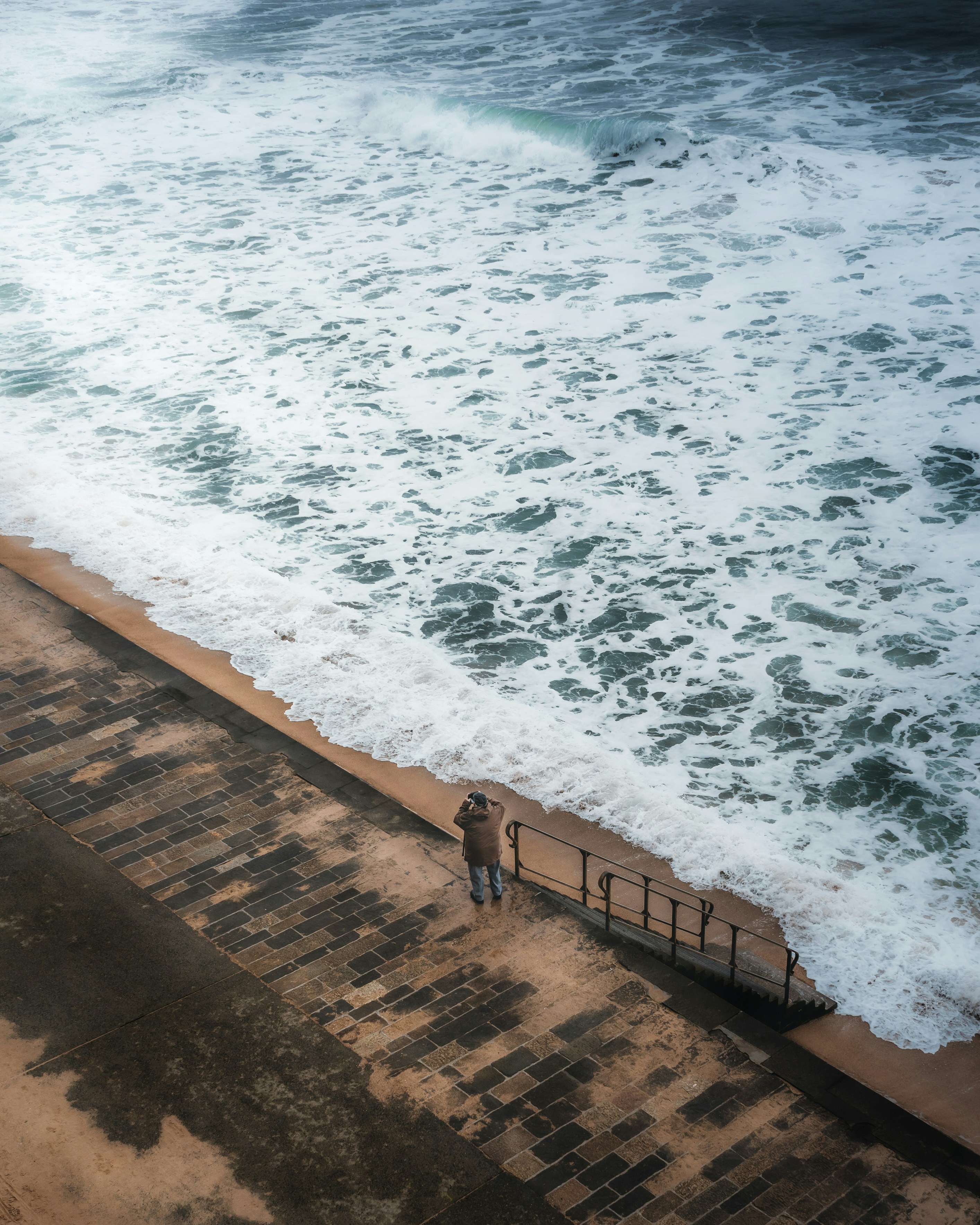 Photographer Photographing Coastal Waves