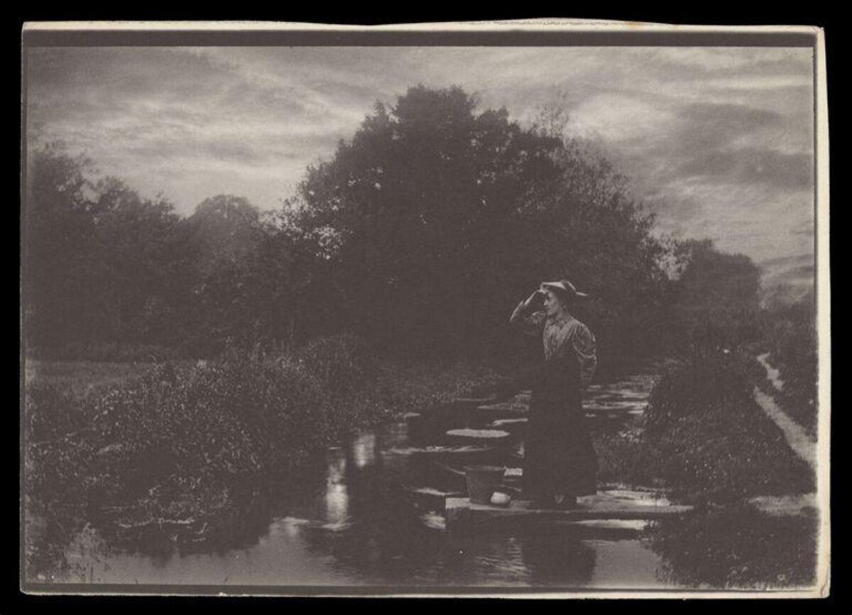 Woman Waiting At Stream Crossing