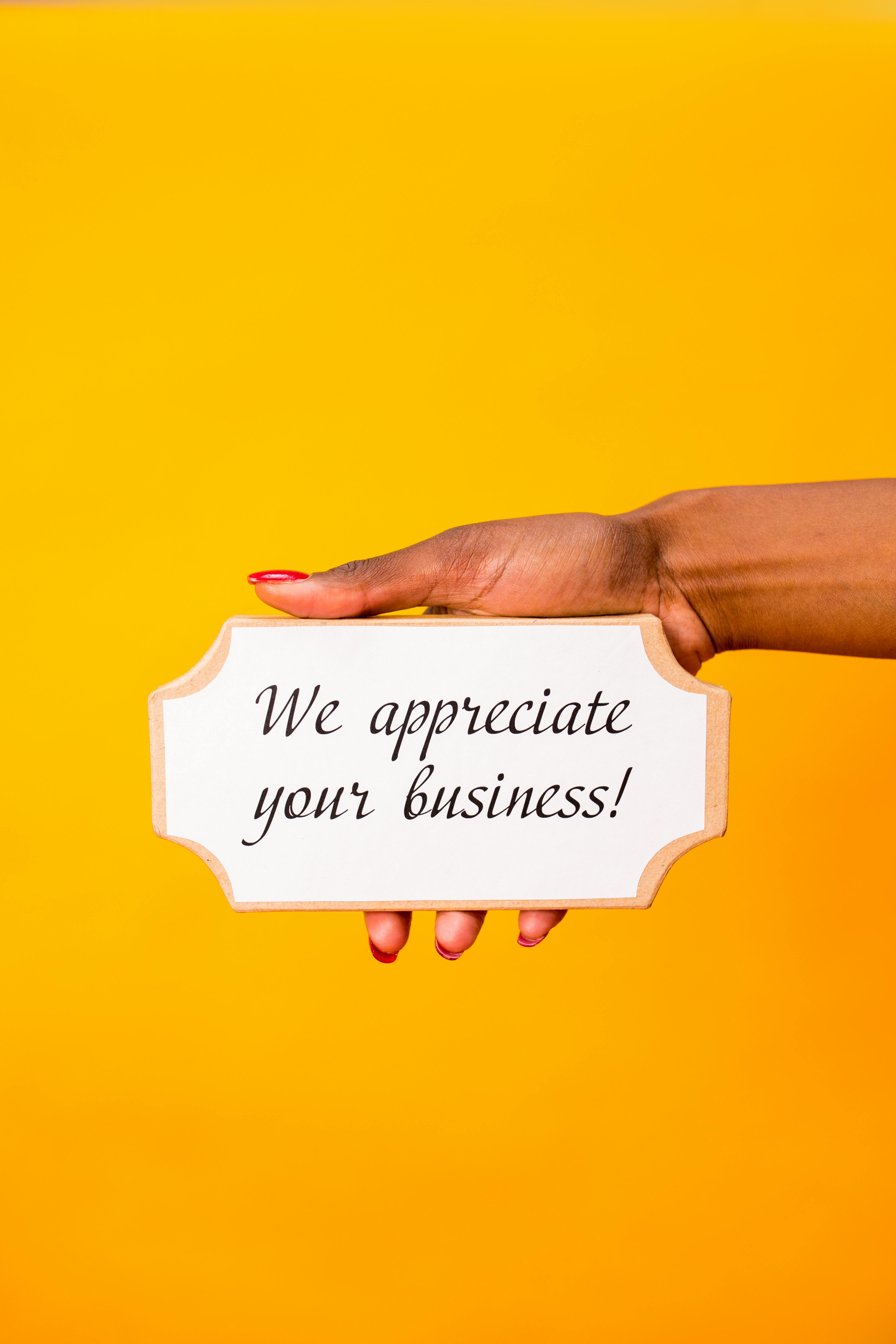 Hand Holding We Appreciate Your Business Sign