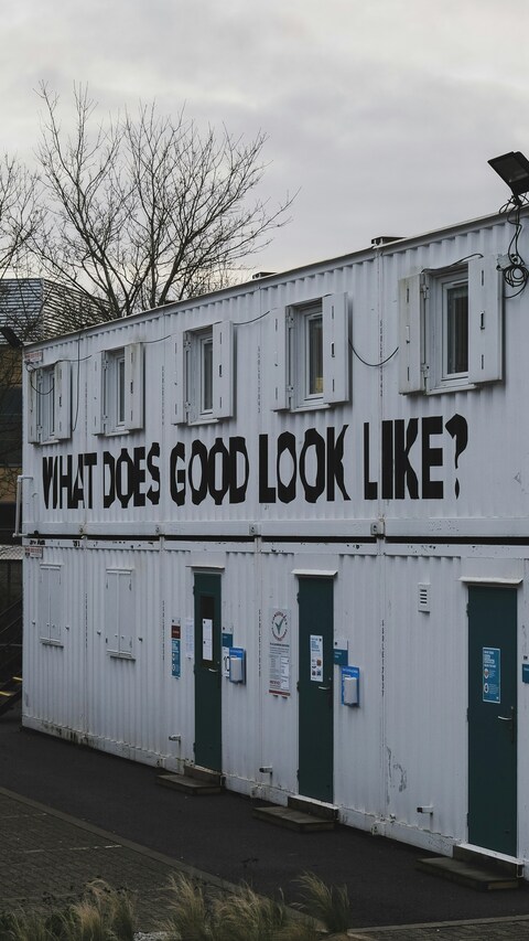Two-story White Container Building With Slogan