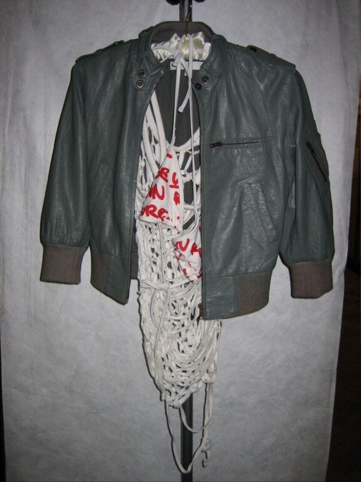 Gray Leather Jacket on Clothing Rack