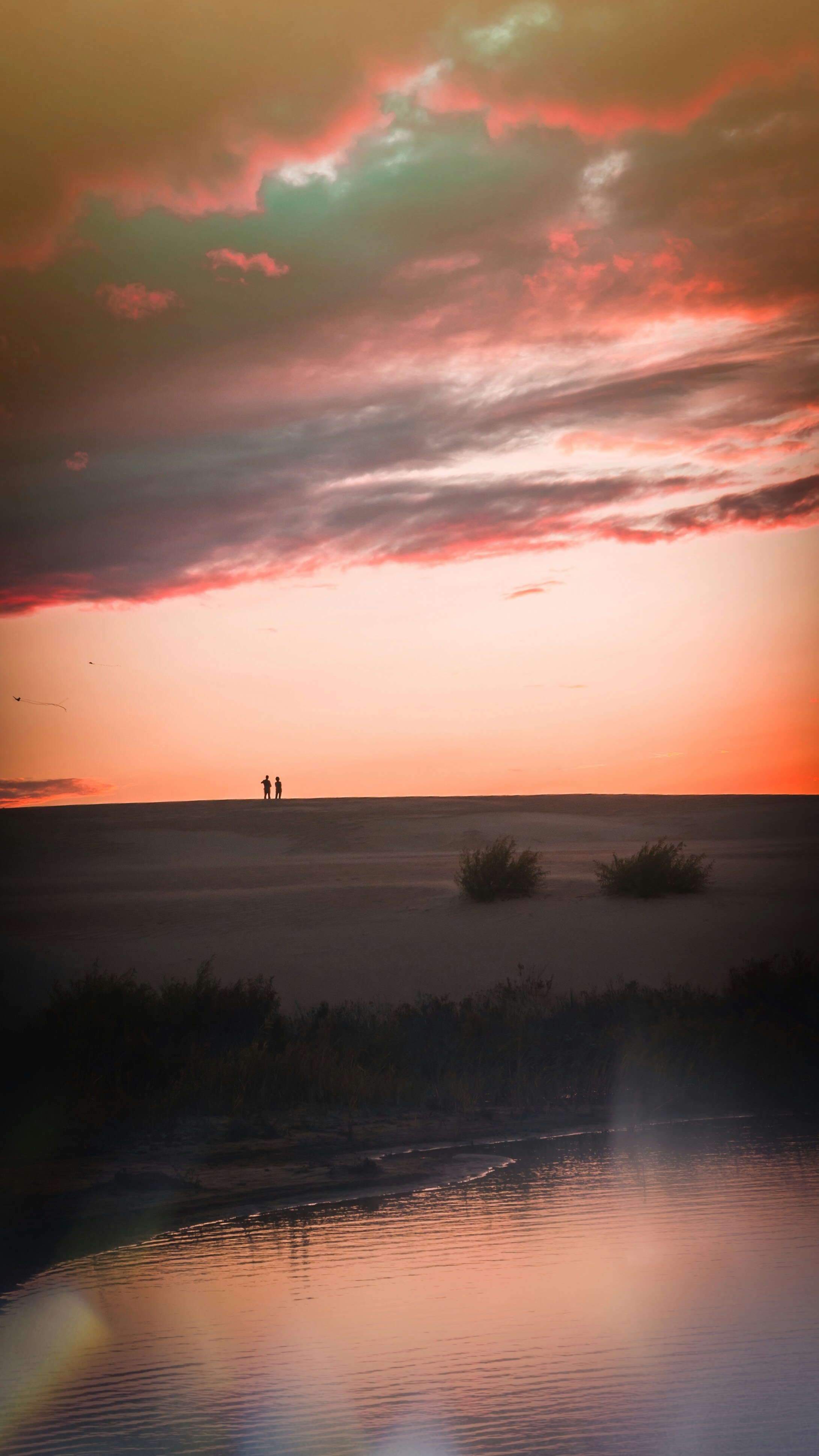 Sunset Over Desert Dune by Water