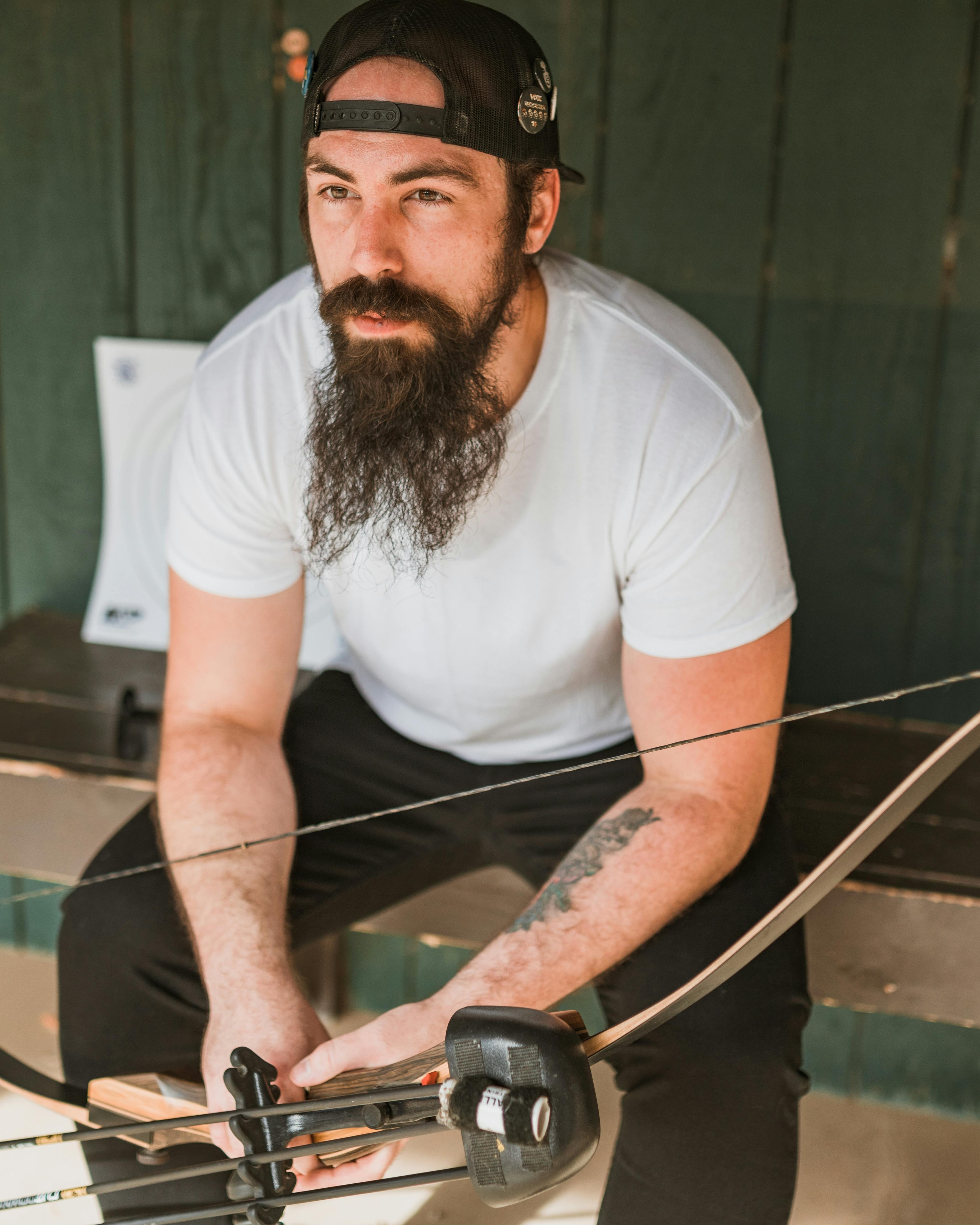 Bearded Man Preparing Archery Bow