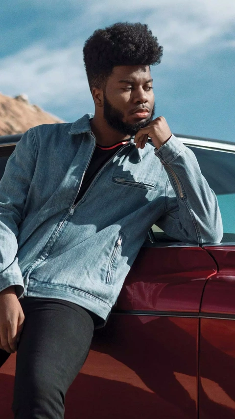 Khalid Leaning on Red Car