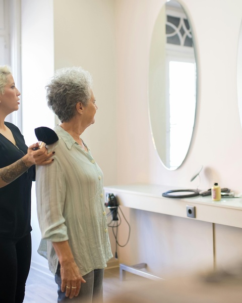 Makeup Artist Preparing Older Woman