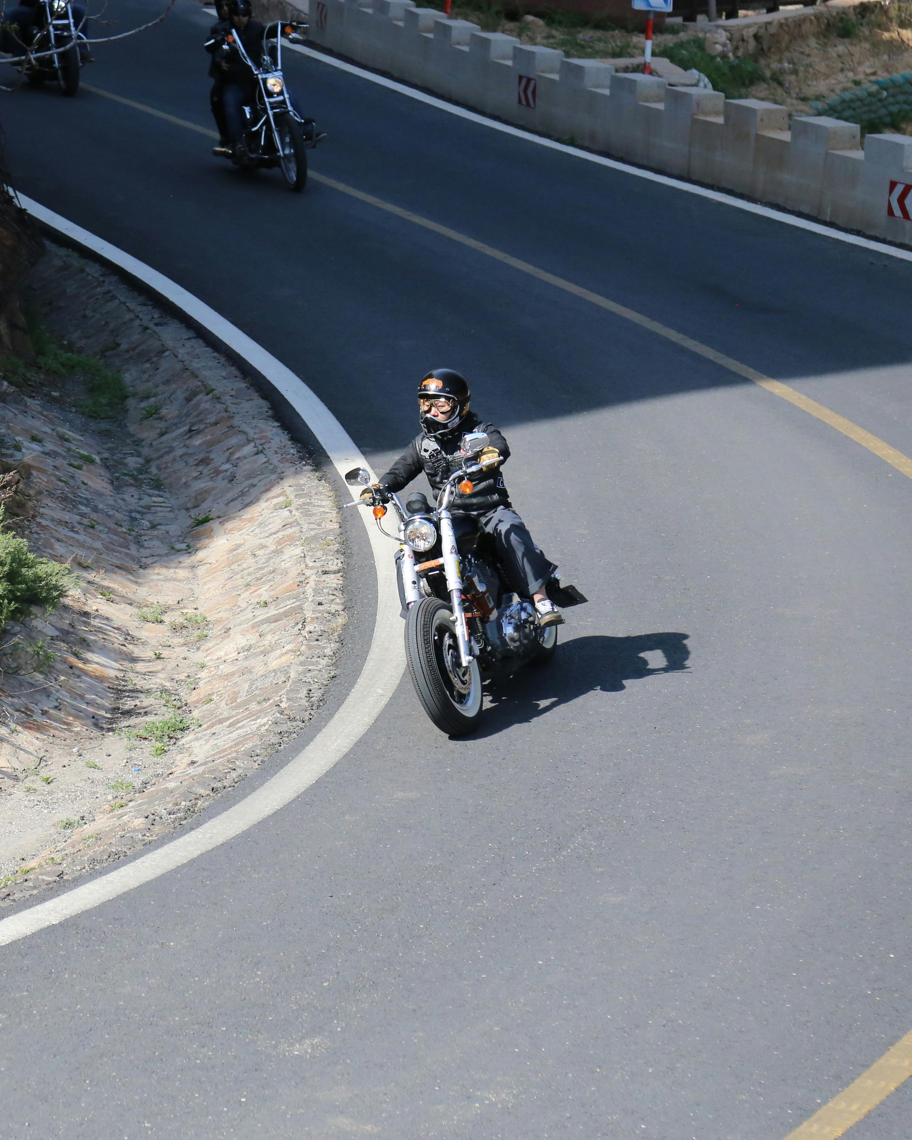 Motorcyclists on Winding Mountain Road