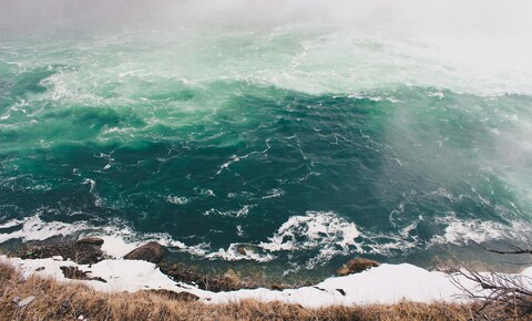Turbulent Turquoise River by Snowy Shore