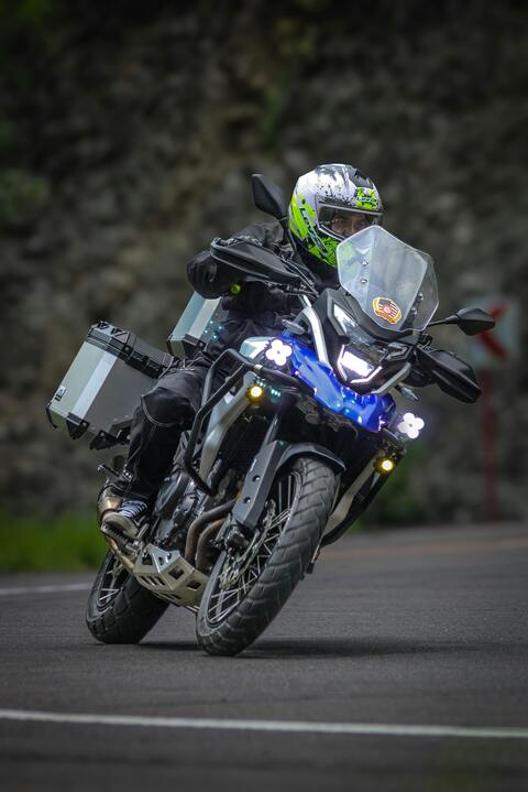 Motorcyclist Leaning Into Road Curve