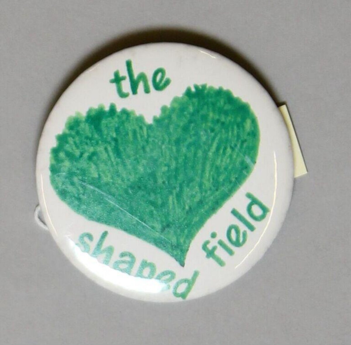 The Heart Shaped Field Badge — Logos