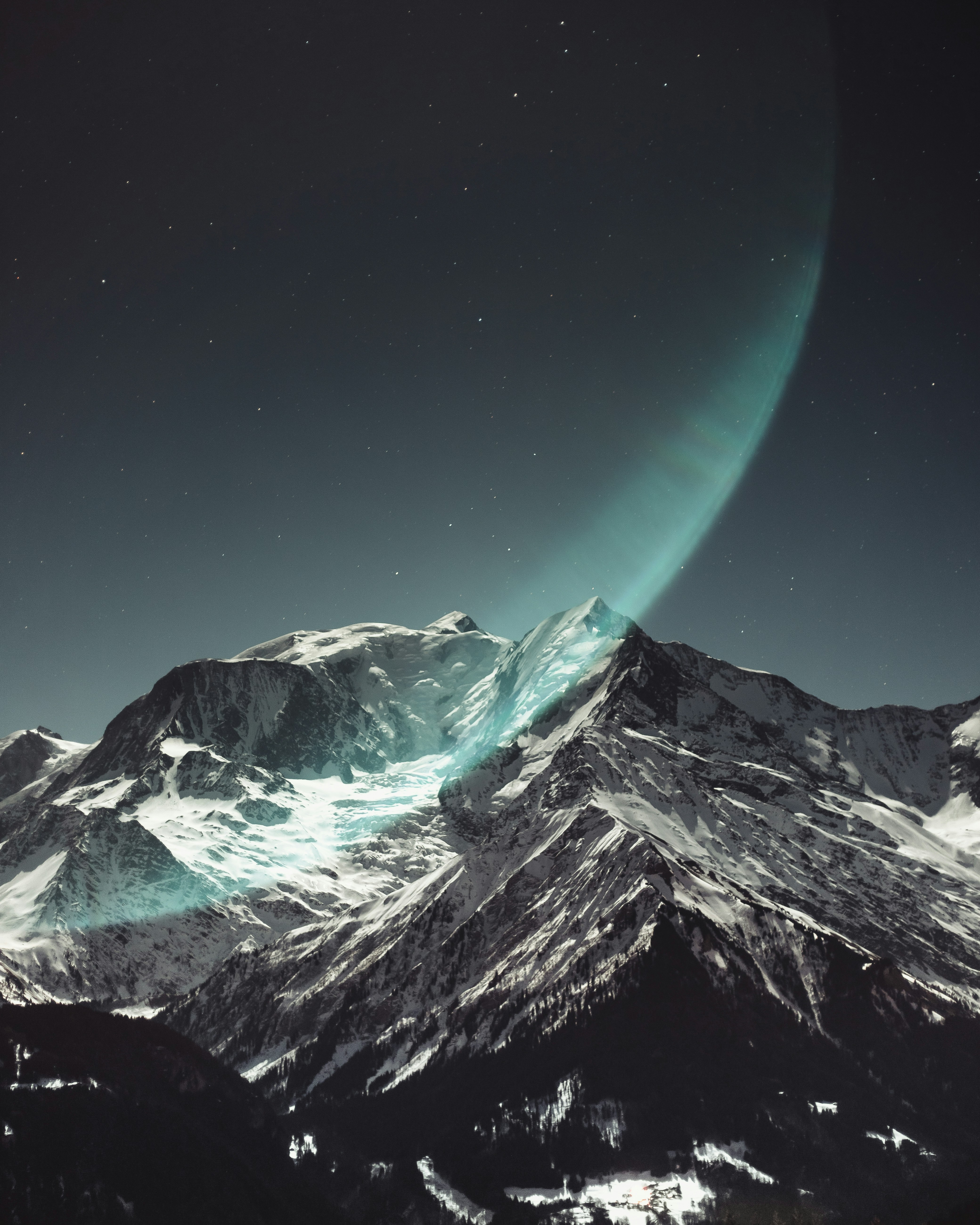 Aurora over Snowy Mountains at Night