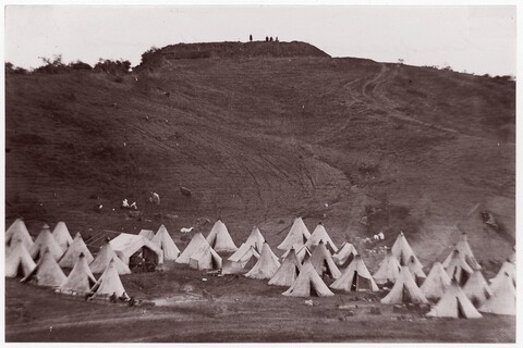 Vintage Camp on Grassy Hillside