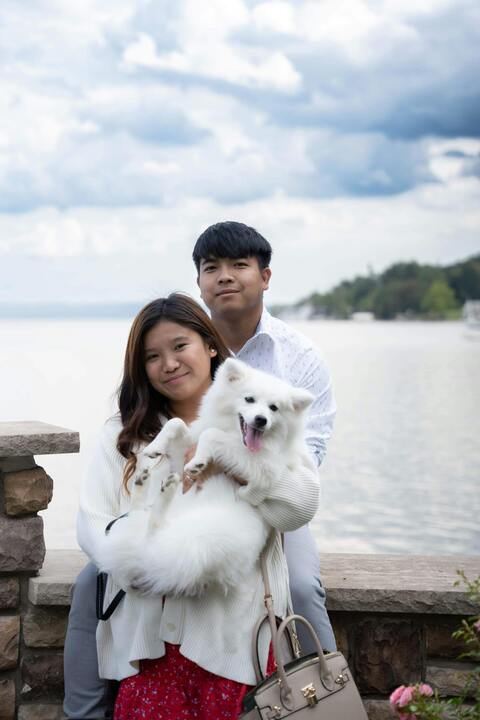 Couple and Dog By Lakeside