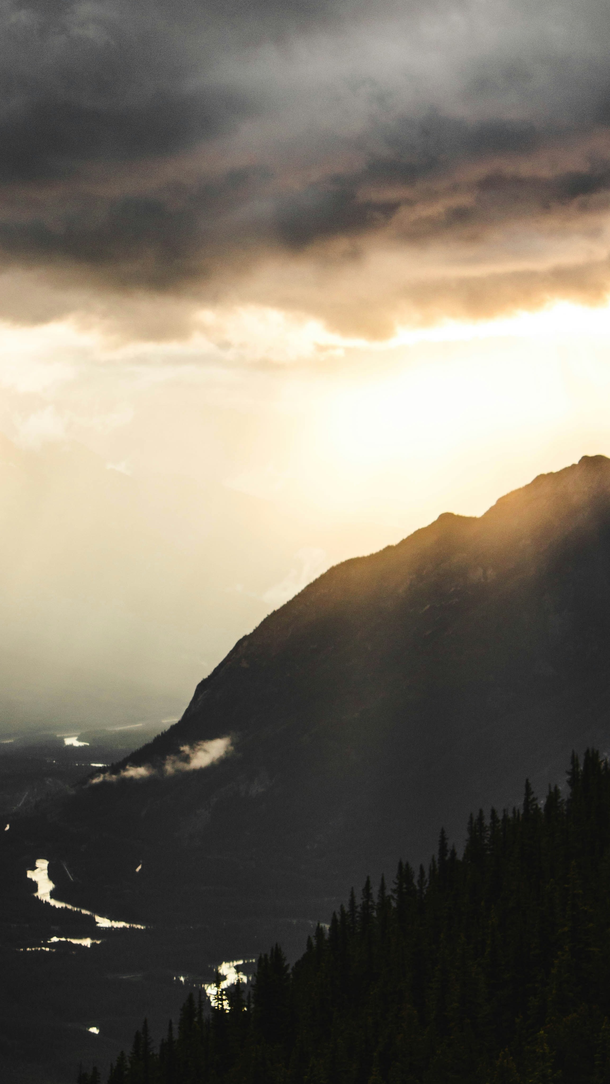 Stormy Sunset Over Mountain Valley