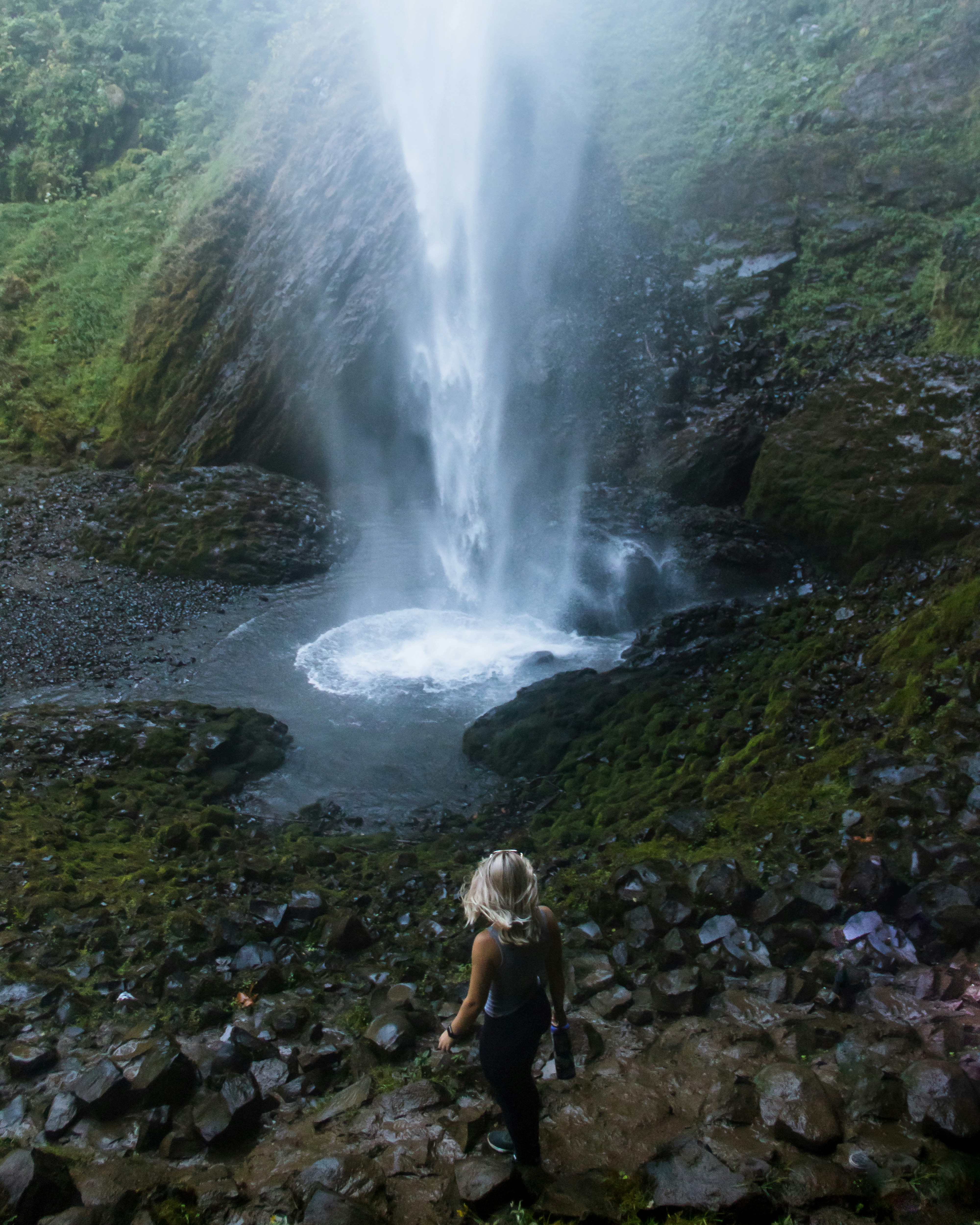 Woman Hiker Approaching Waterfall